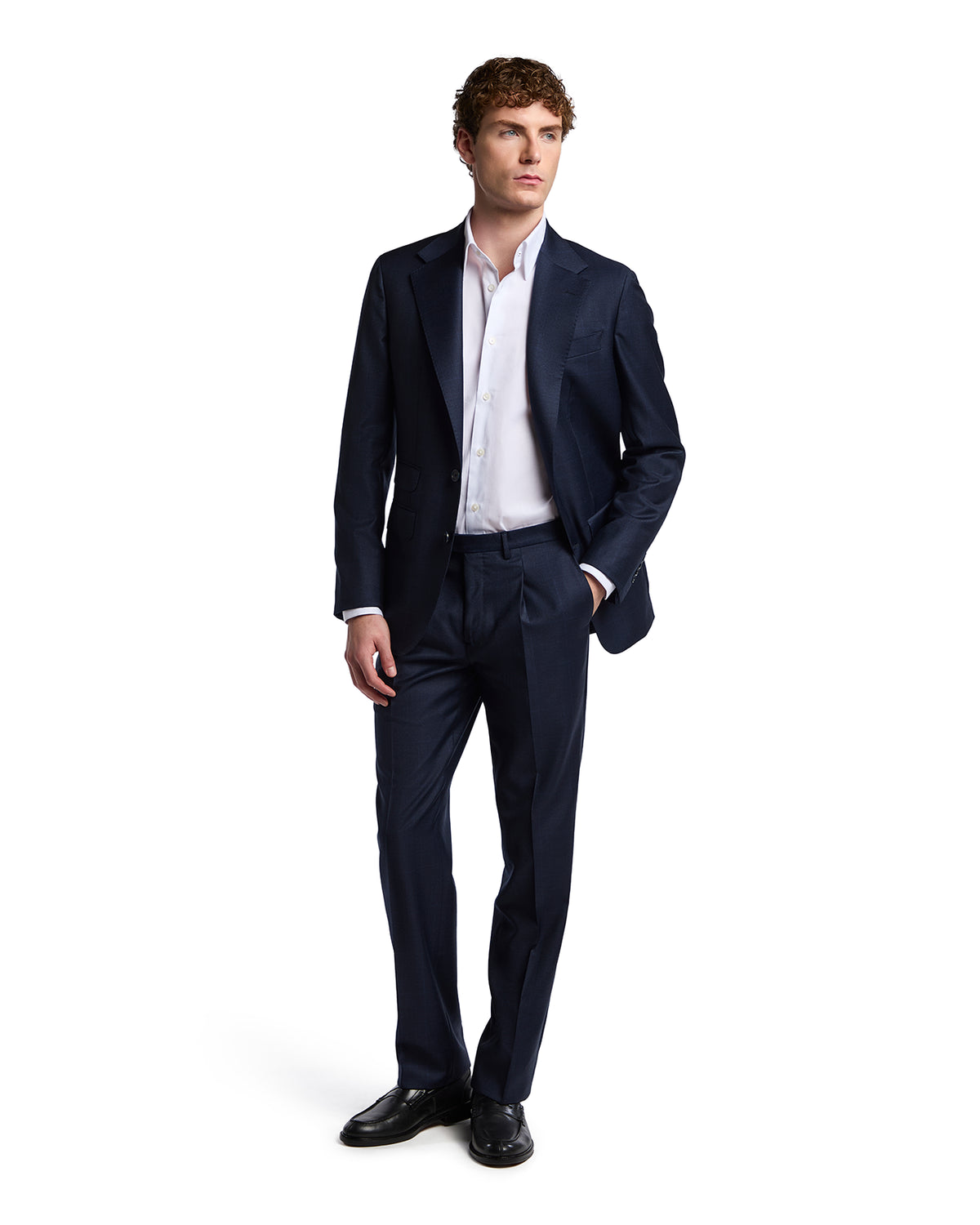 Navy tailored suit for men, made of premium fabric, paired with a classic white dress shirt and black dress shoes.