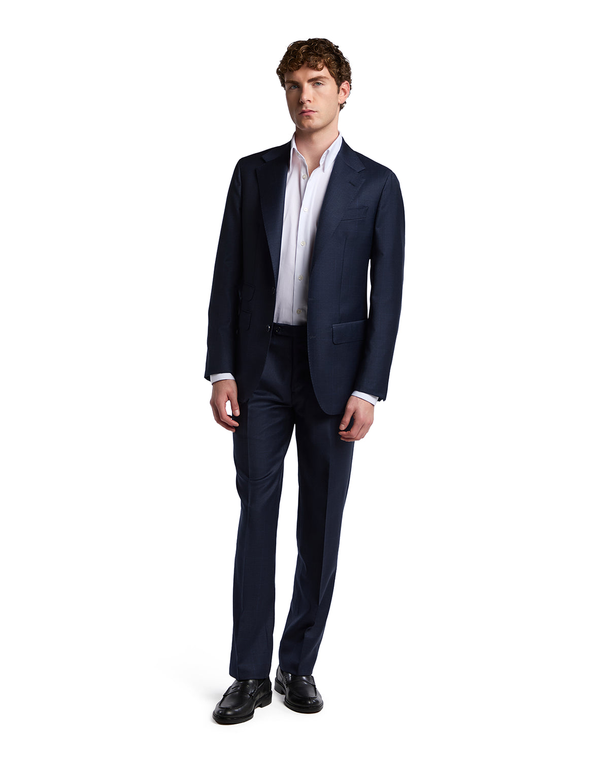 Navy blue tailored suit in lightweight wool blend, featuring a modern fit and notched lapels, paired with a crisp white shirt.