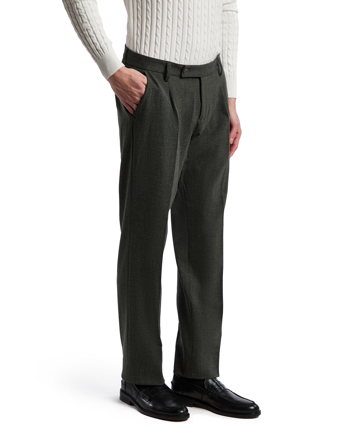Men's dark green wool blend dress pants, tailored fit, styled with a cream knitted sweater and black leather shoes.
