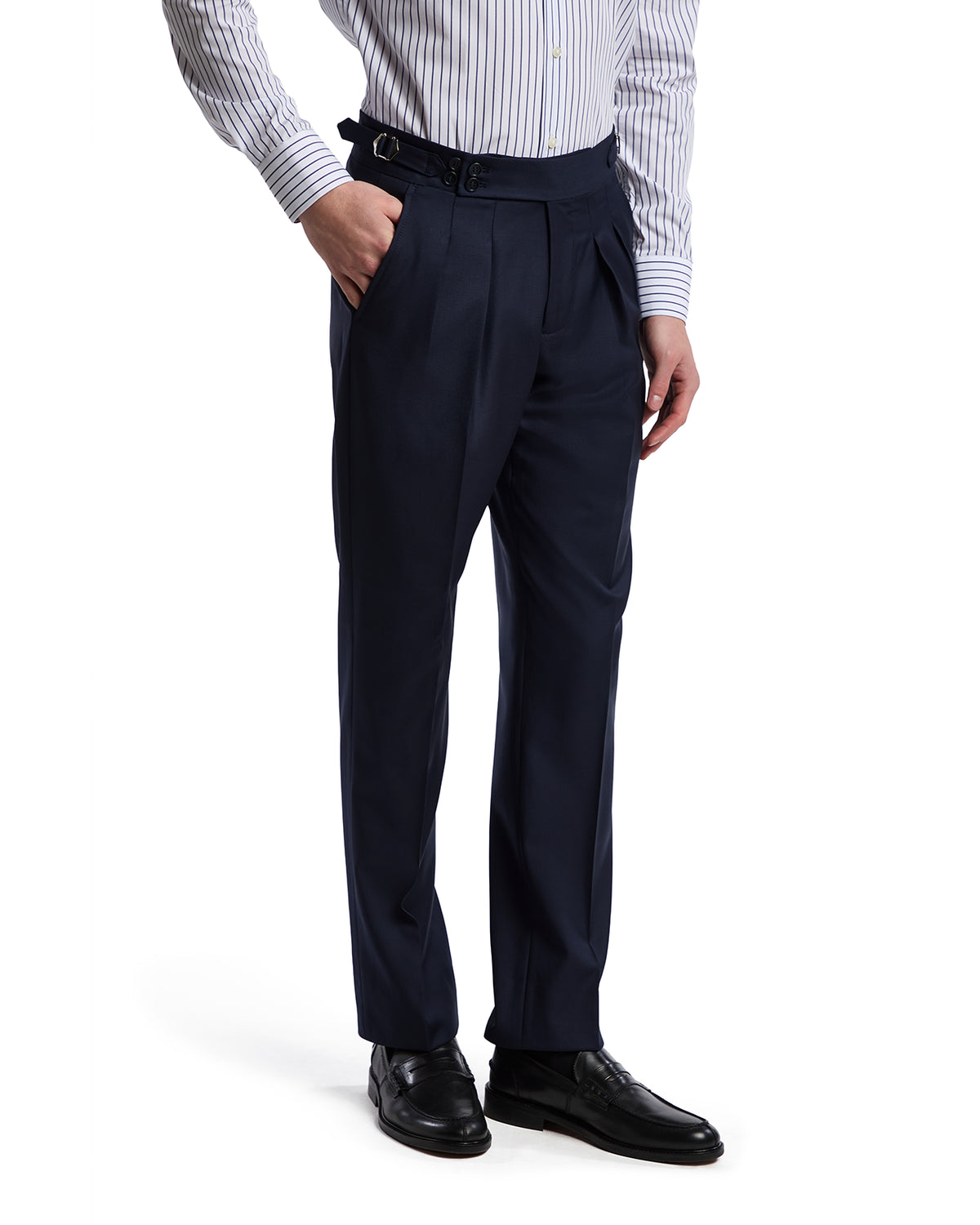 Navy pleated dress pants with a belt, featuring a tailored fit and paired with a striped shirt and black leather shoes.