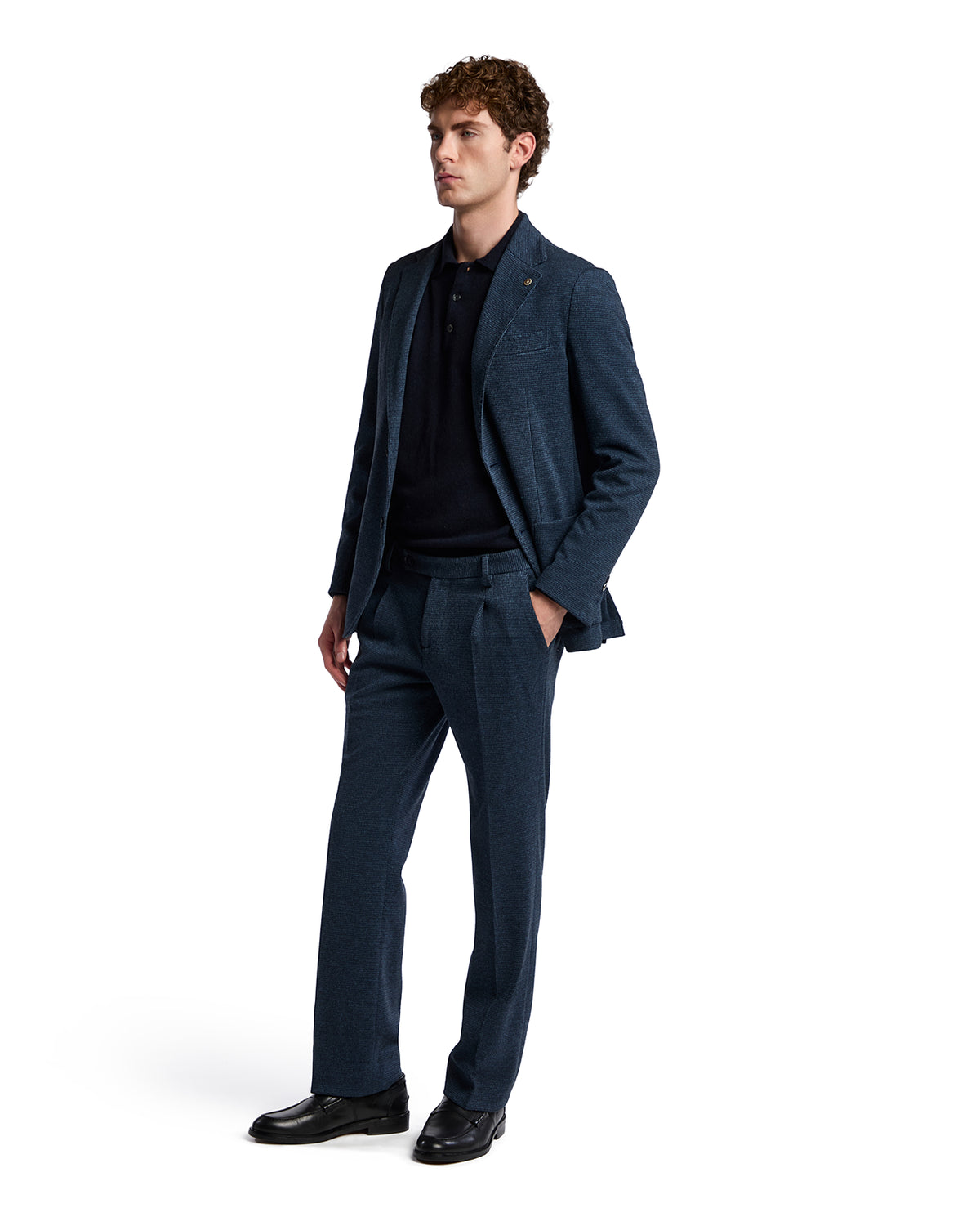 Men's tailored dark blue wool suit with a classic fit, featuring a notched lapel and matching trousers.
