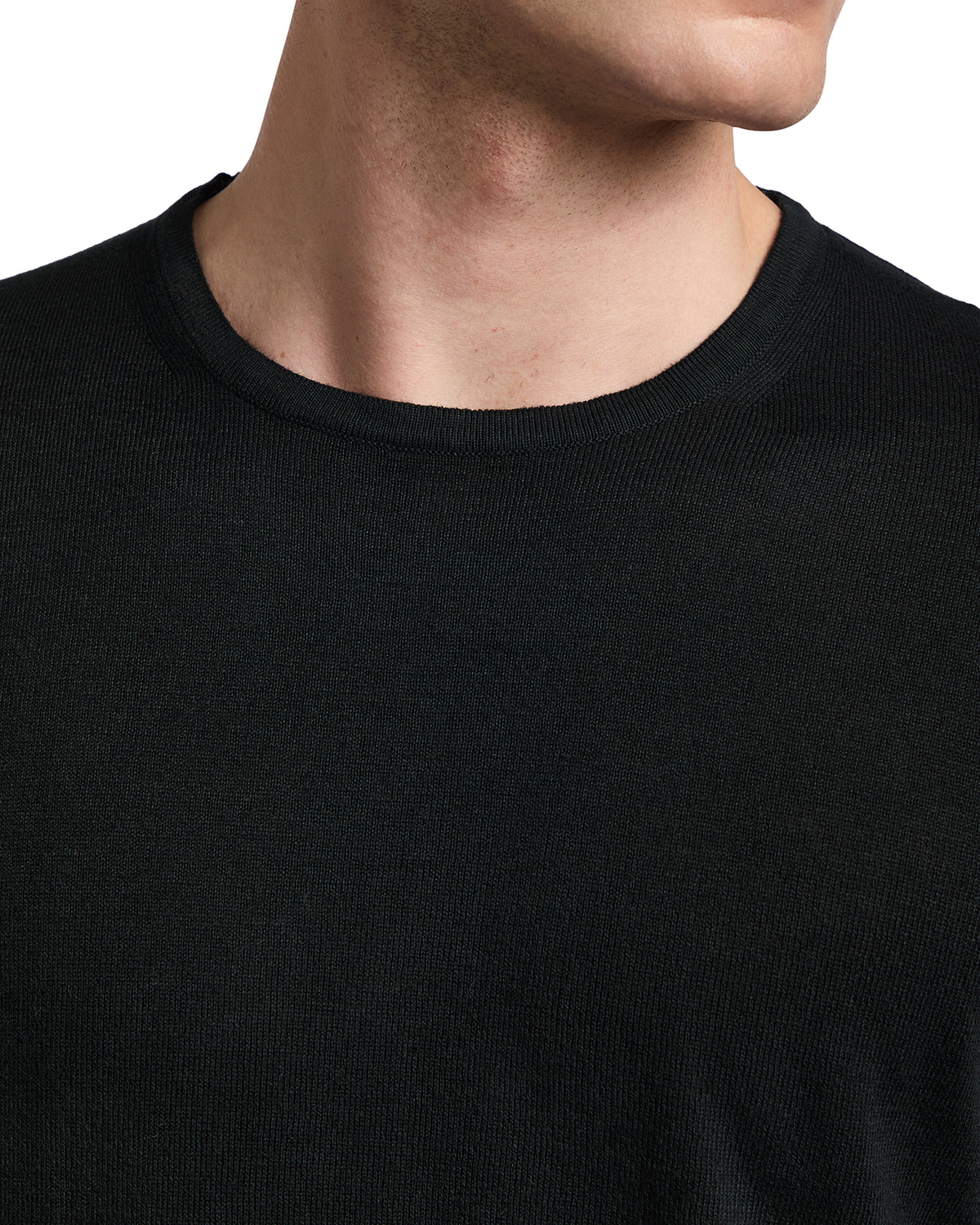 Men's black crew neck knit sweater, soft fabric, casual style, perfect for layering in any season.