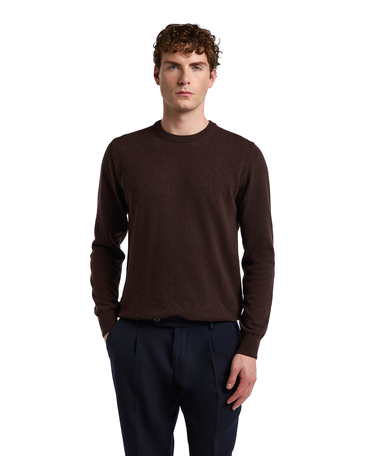 Brown cashmere knit sweater for men in a classic fit, paired with navy trousers for a stylish look.