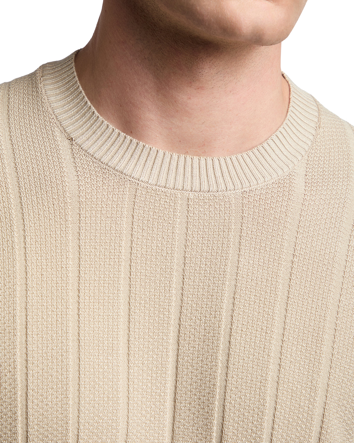 Beige ribbed knit sweater with a crew neckline, crafted from soft, breathable fabric for a modern casual look.