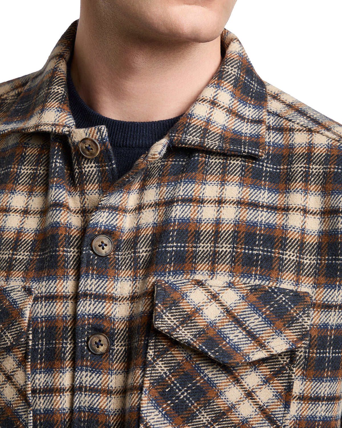 Men's plaid shirt jacket in beige, navy, and rust, crafted from soft wool blend with stylish button-down closure.