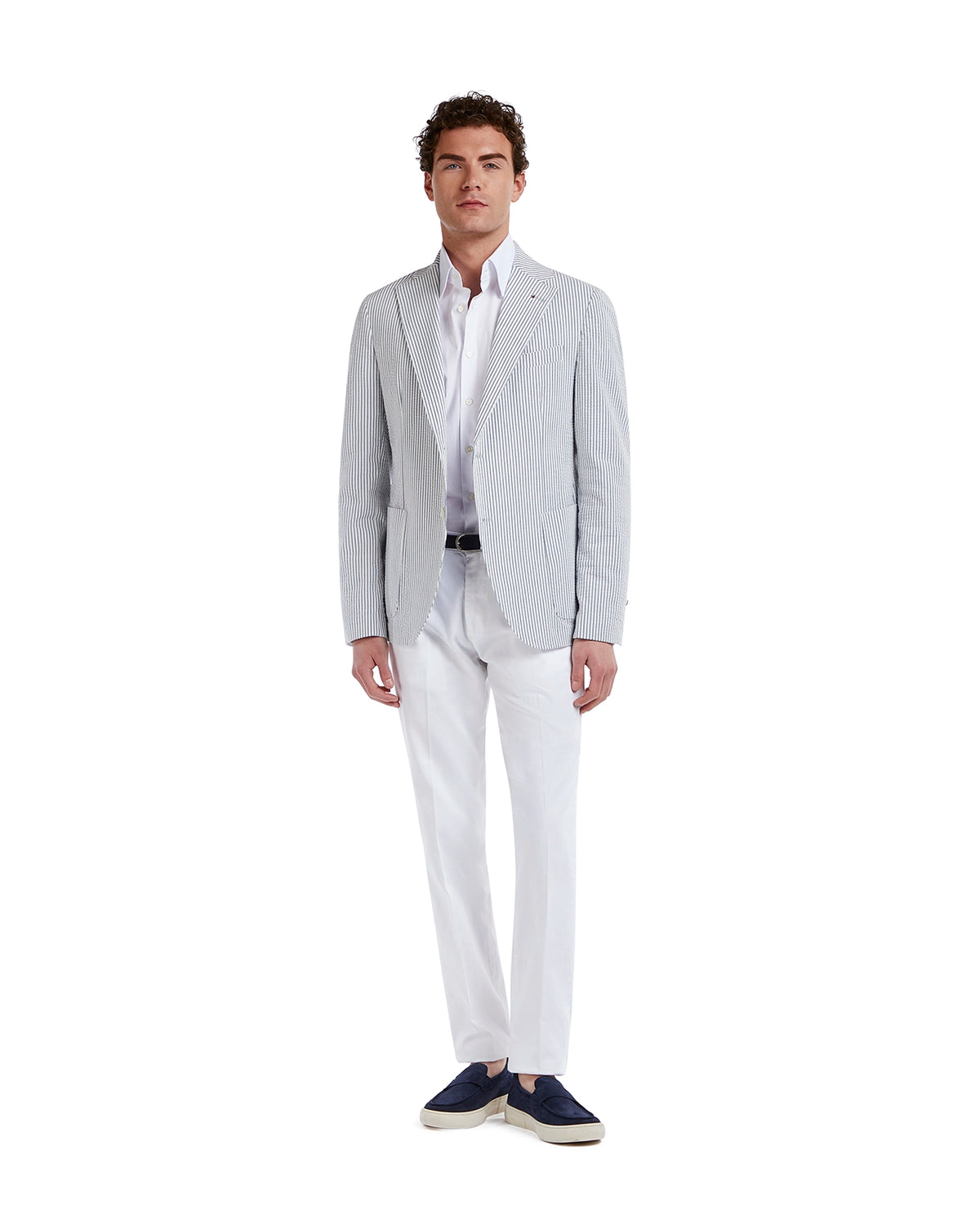 Light blue striped blazer in cotton linen blend, paired with a white shirt and tailored white trousers for a modern look.