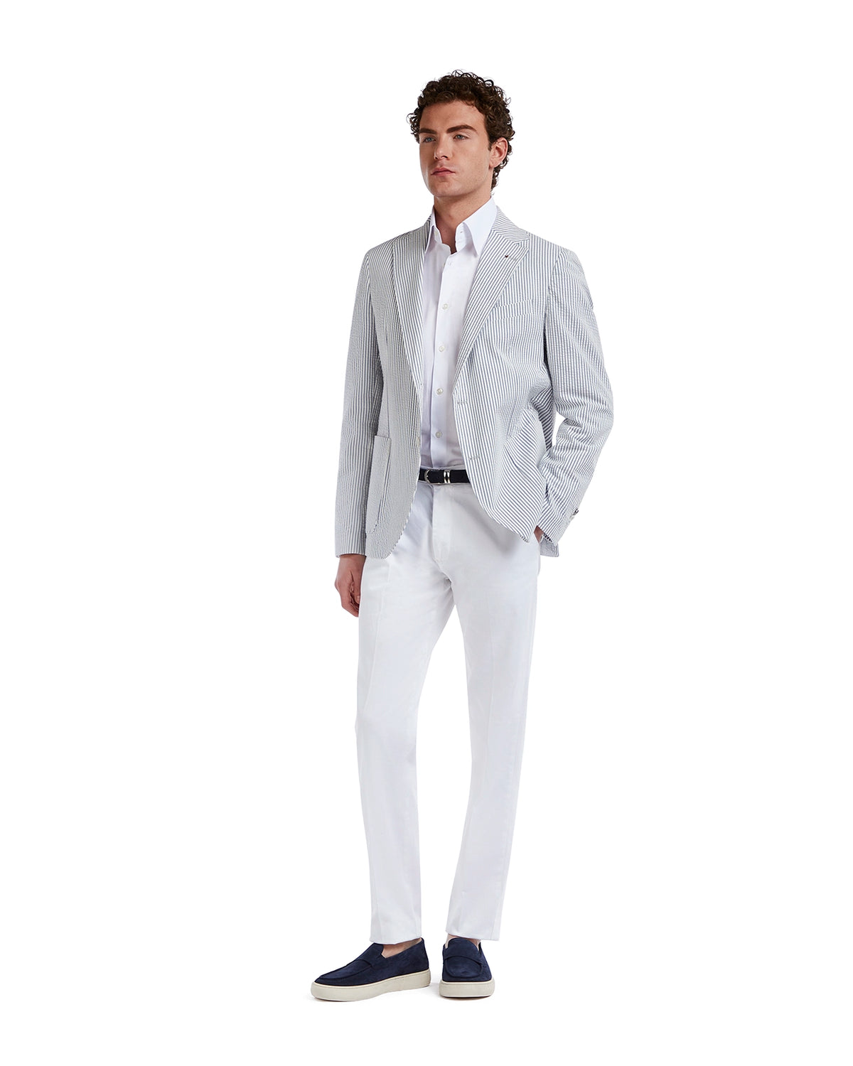 Men's striped blazer in blue and white, paired with a white shirt and light trousers for a smart casual look.