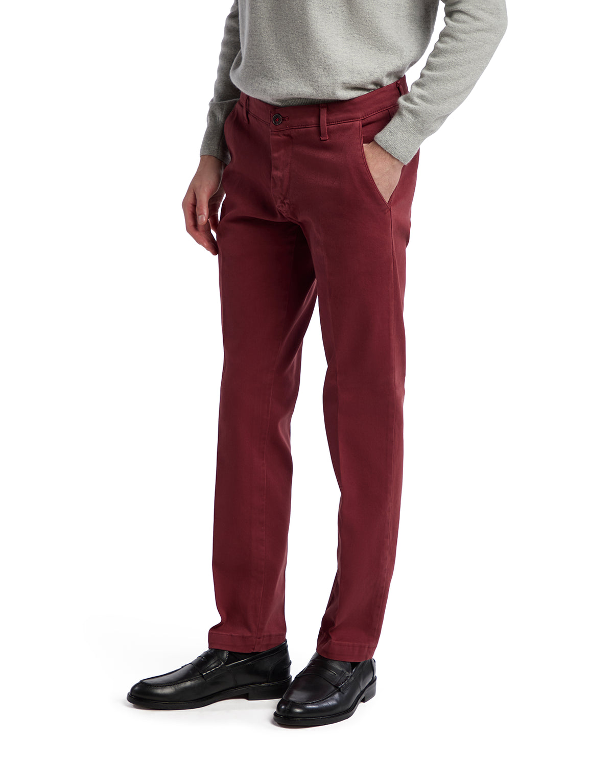 Men's burgundy straight-fit chinos, made of soft cotton, paired with a light gray sweater and black dress shoes.