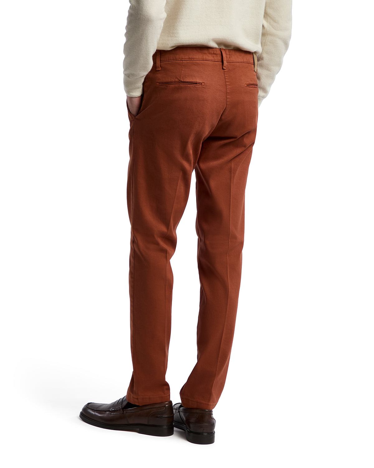 Men's rust-colored chino pants, tailored fit, cotton blend material, featuring back zip pockets.