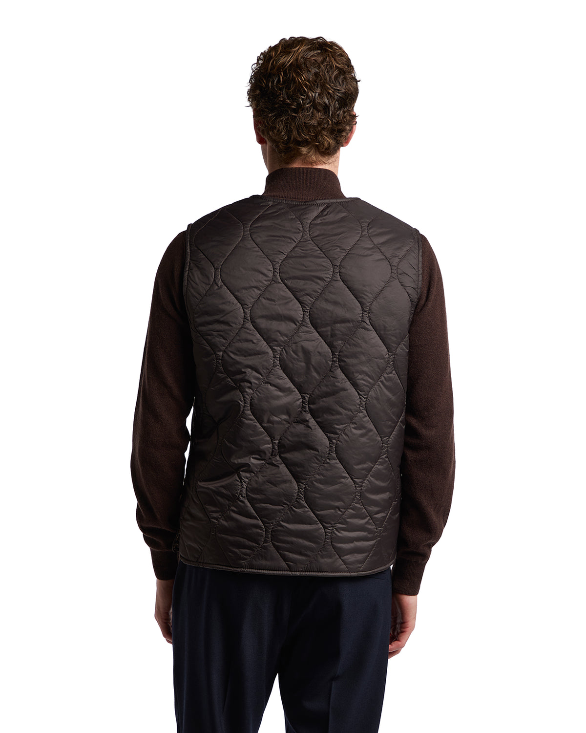 Men's brown quilted vest in lightweight nylon, perfect for casual layering in cold weather.