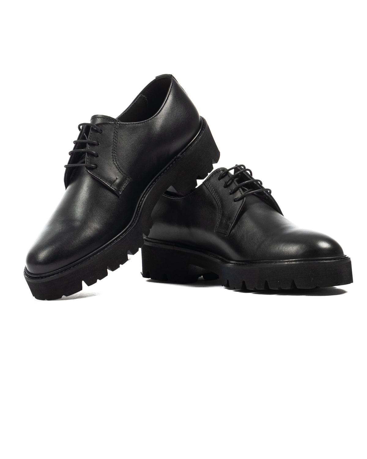 Black leather lace-up platform shoes with chunky lug sole, sleek Derby style for men and women.
