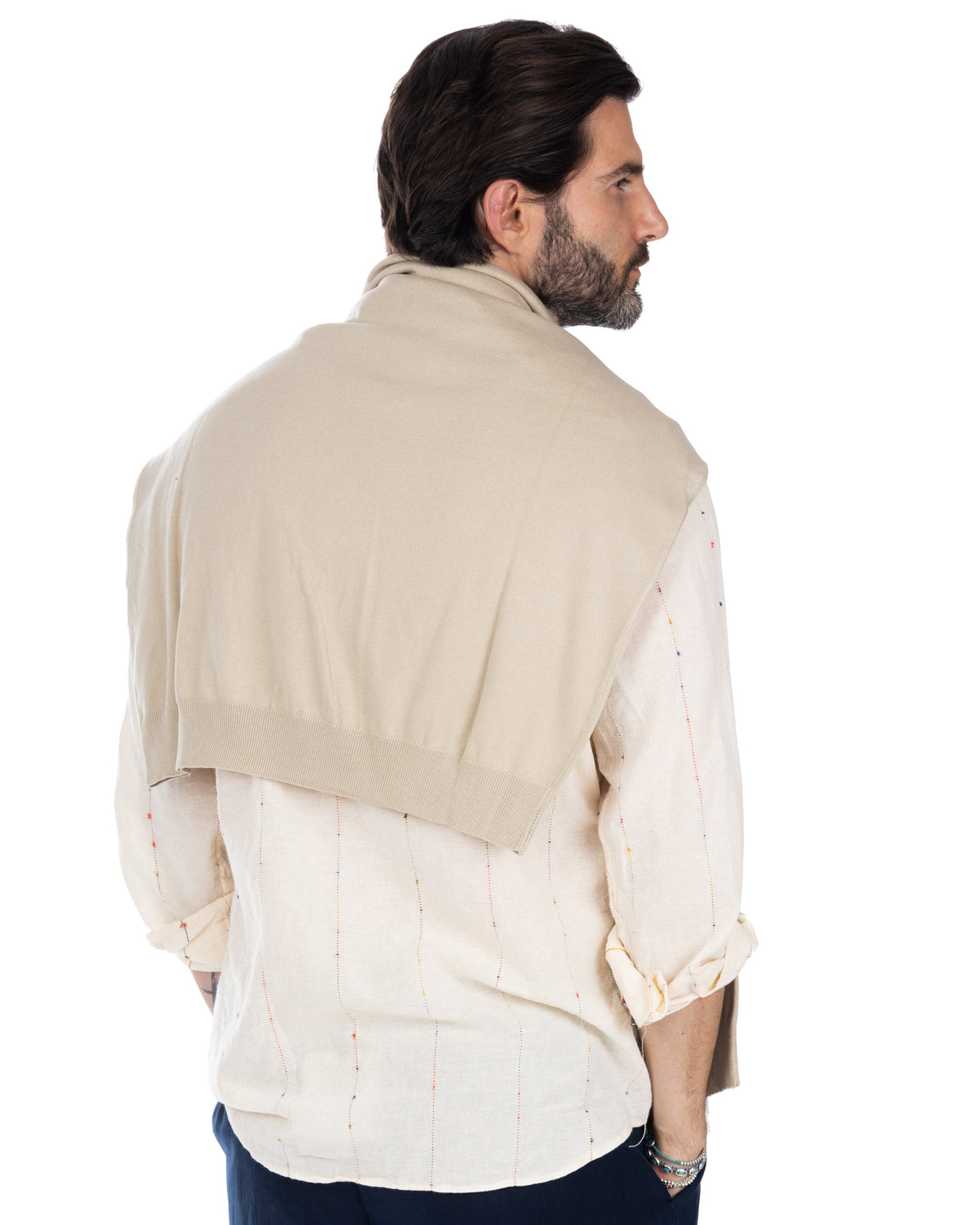 Beige cotton knit shawl collar sweater layered over white embroidered linen shirt, men's casual style
