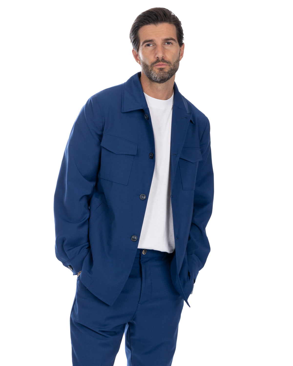 Men's navy blue cotton twill chore jacket with button front, chest pockets, and relaxed fit.