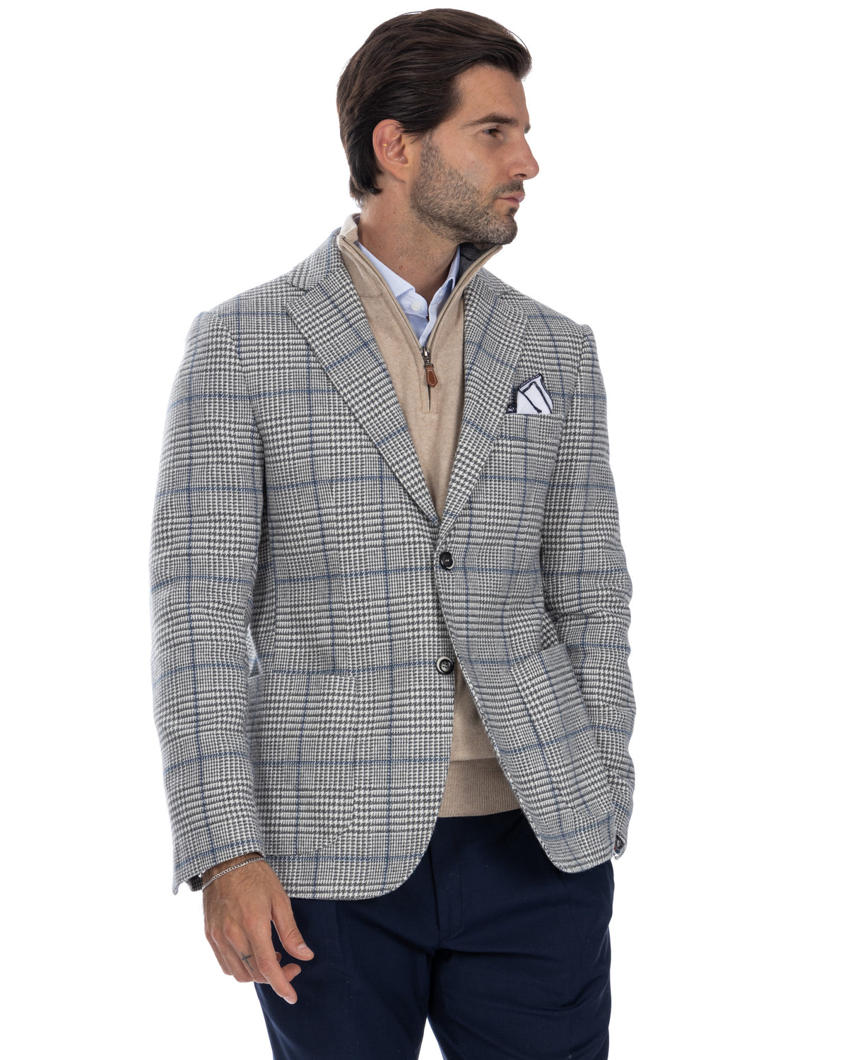 Men's grey plaid wool blazer with notched lapels, two-button closure, and patch pocket. Business casual style.