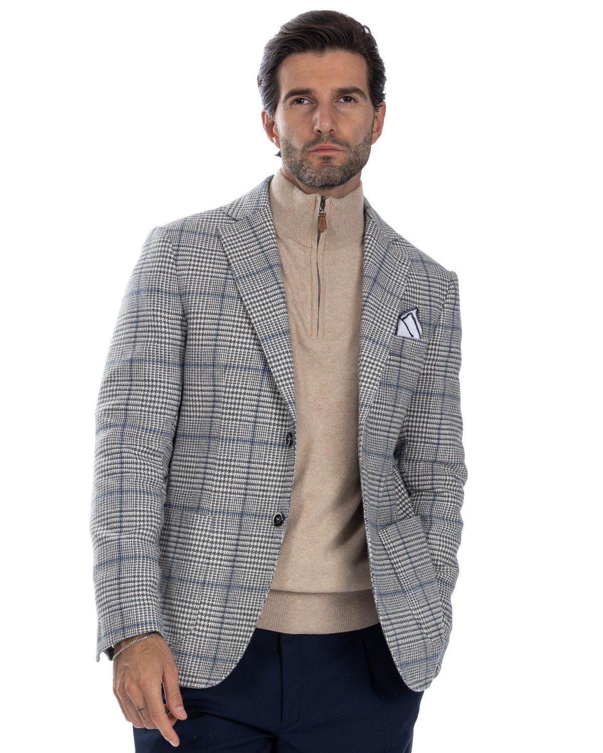 Men's grey plaid wool blazer with beige zip sweater, navy trousers. Smart casual tailored jacket with pocket square.