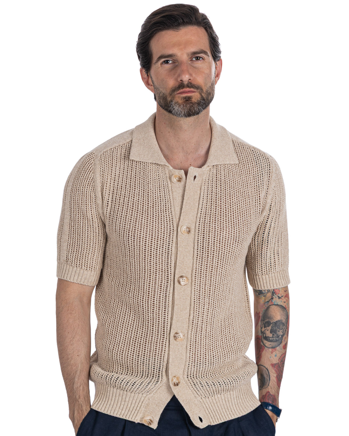 Beige short sleeve knit cardigan with open weave texture, polo collar, and mother-of-pearl buttons.