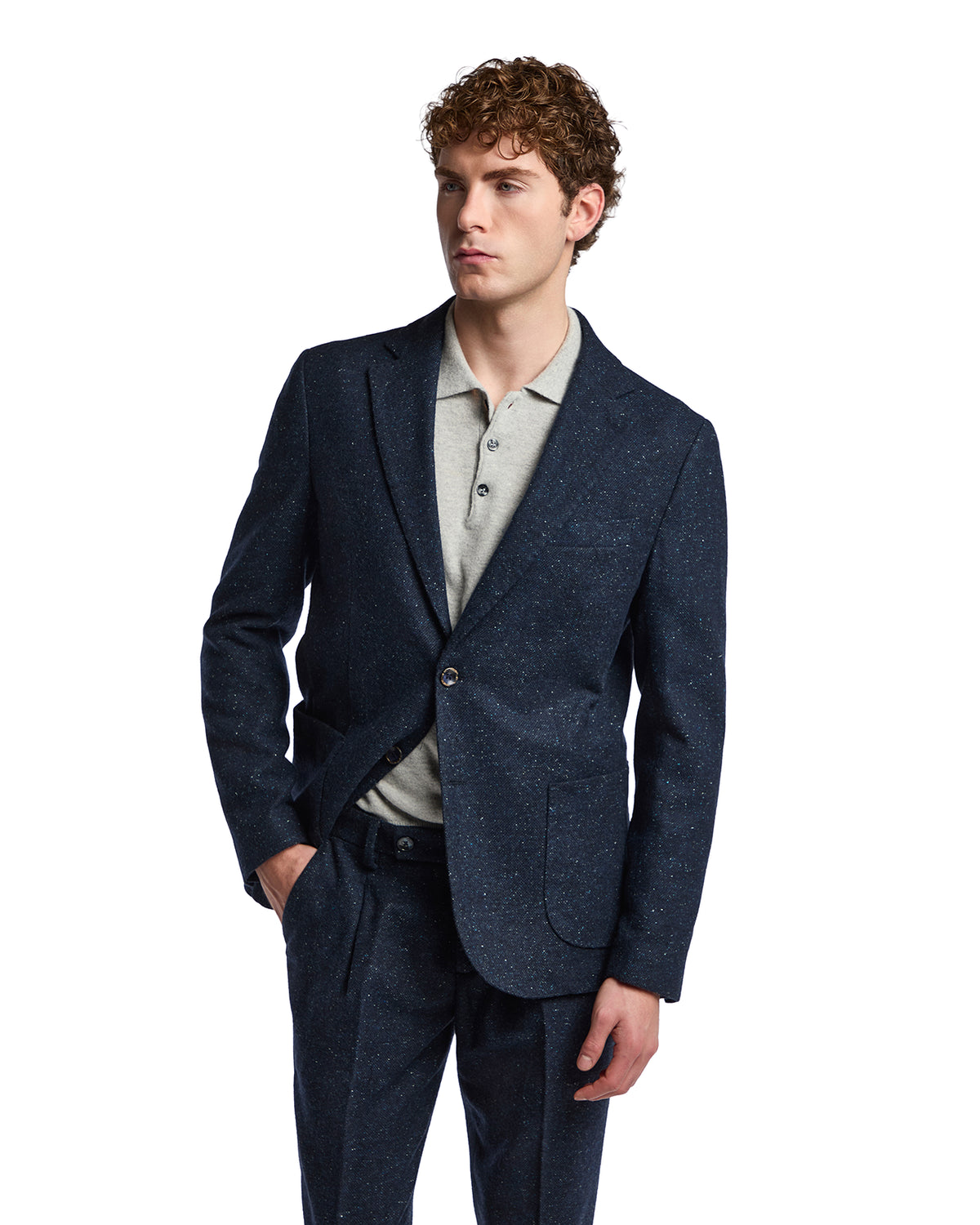 Navy speckled blazer paired with a light gray polo, ideal for smart-casual occasions. Tailored fit and modern style.