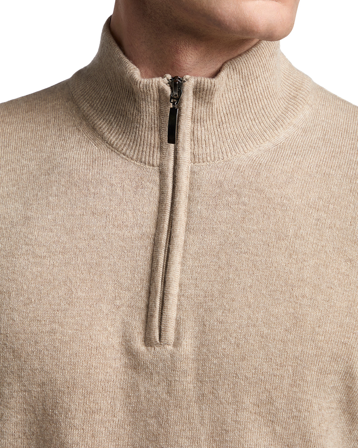 Beige zip-up sweater in soft knit fabric with a high collar, perfect for casual or semi-formal wear.