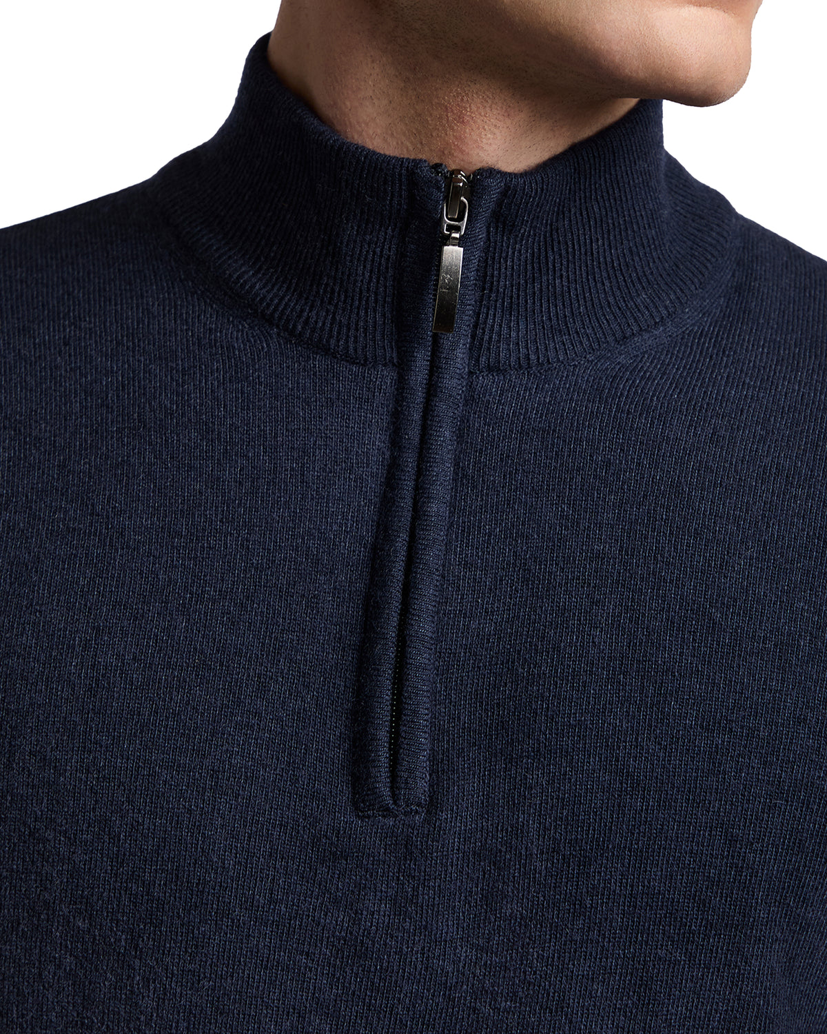Navy blue zip-neck sweater, crafted from fine knit material for a sleek, modern style.