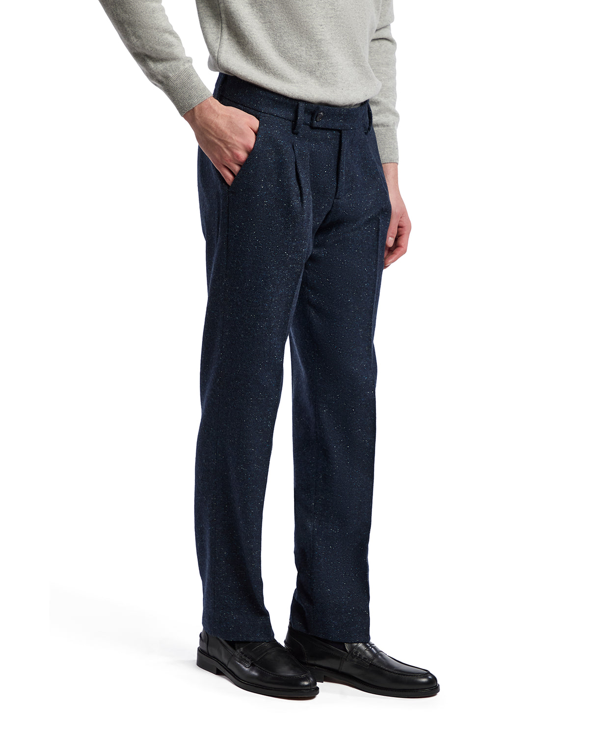 Men's navy speckled dress pants in a tailored fit, made of textured fabric, paired with a casual sweater.