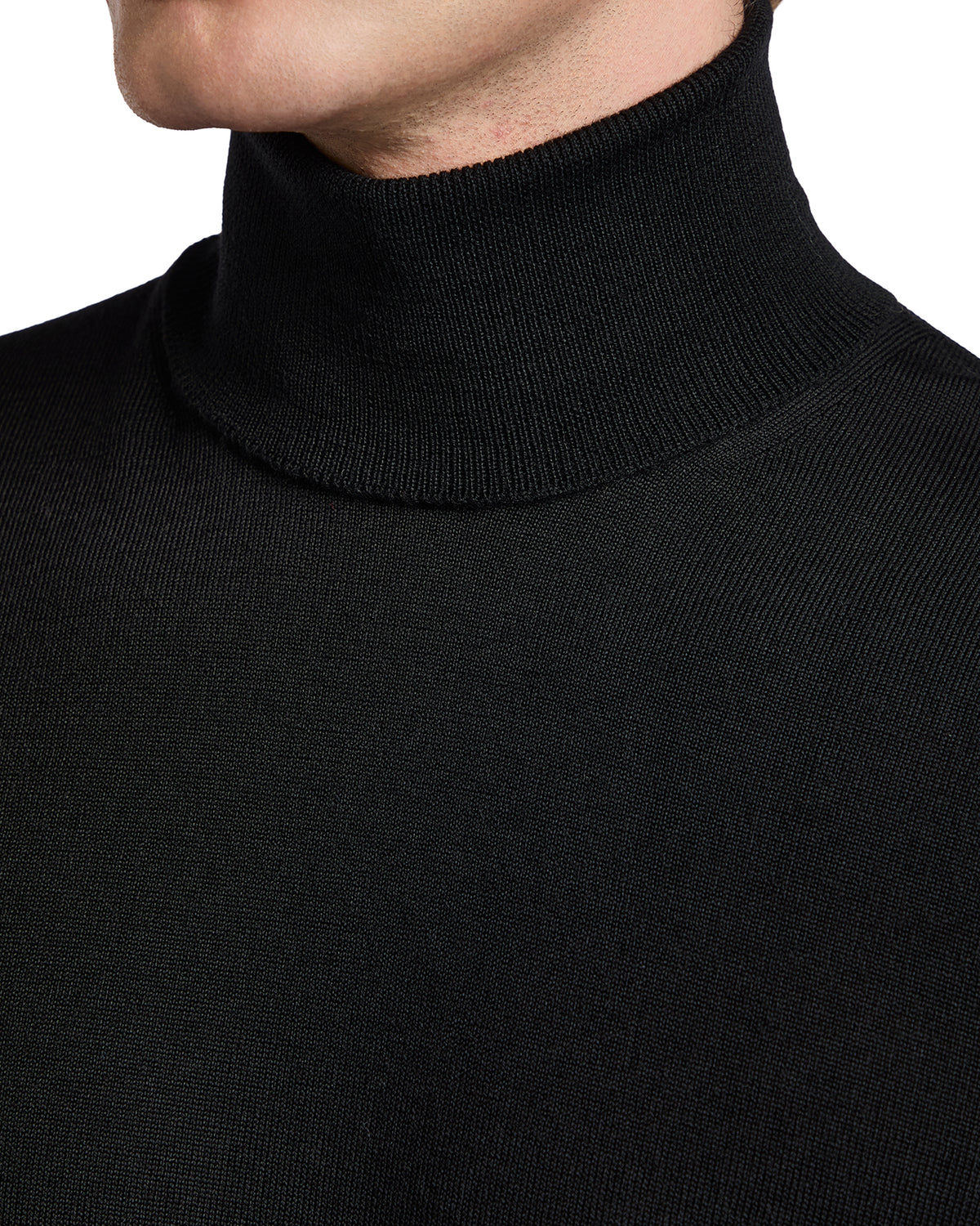Black knit turtleneck sweater for men, made from soft, breathable fabric, perfect for layering in any season.