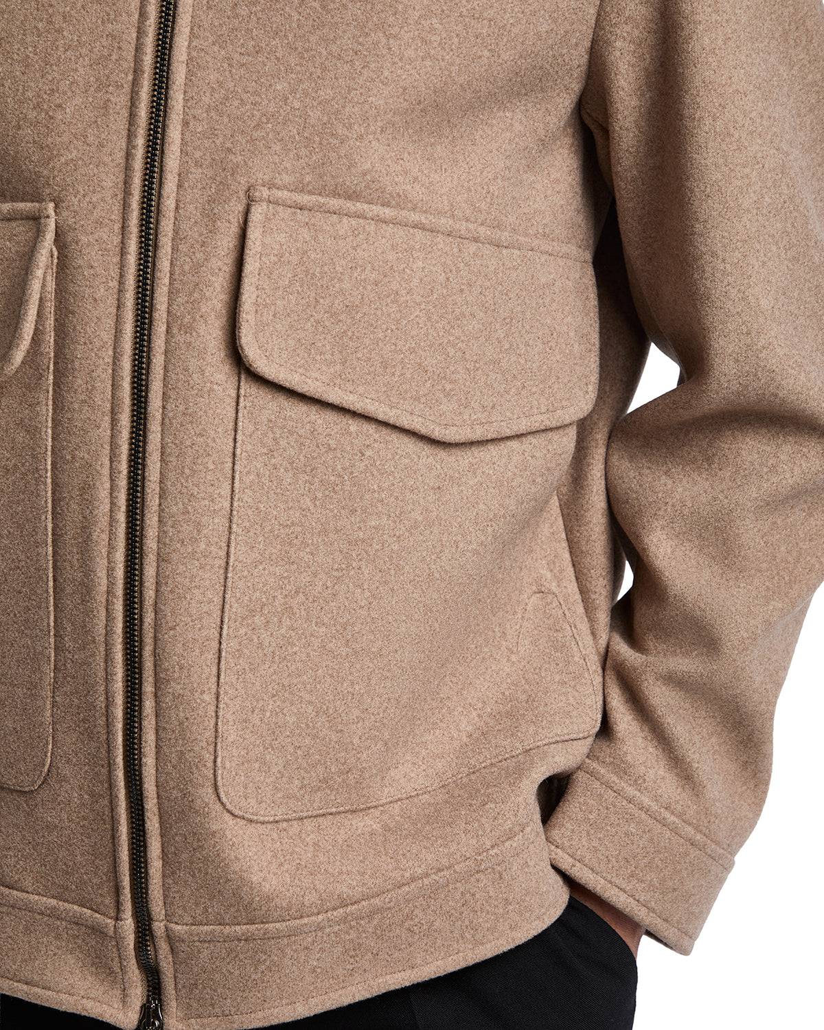 Beige wool blend zip-up jacket with two front pockets, perfect for casual layering in cooler weather.