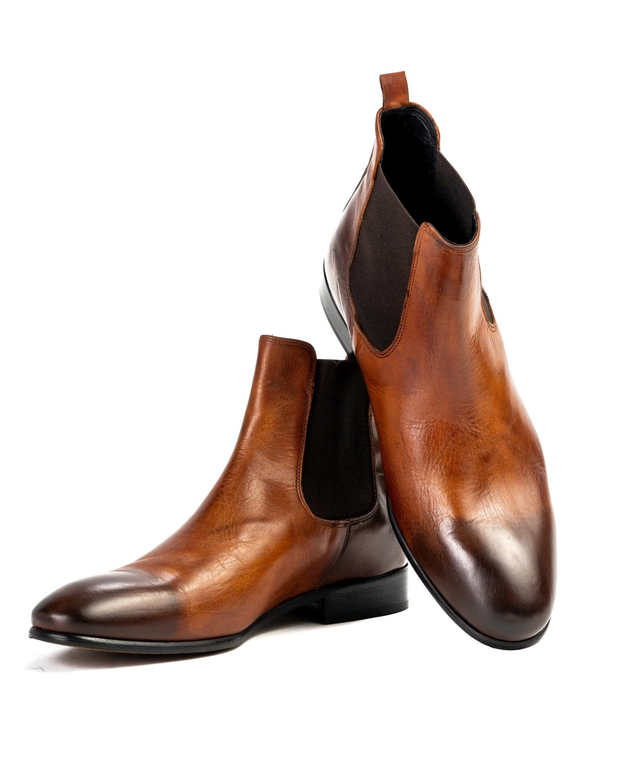 Brown leather Chelsea boots with sleek design and elastic side panels, perfect for formal and casual wear.