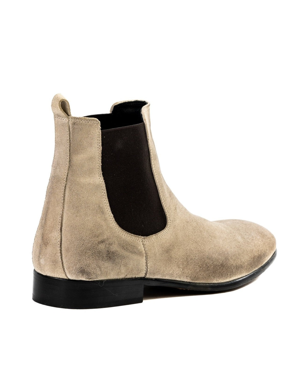 Beige suede Chelsea boots with black elastic panels and a low heel for a stylish, versatile look.