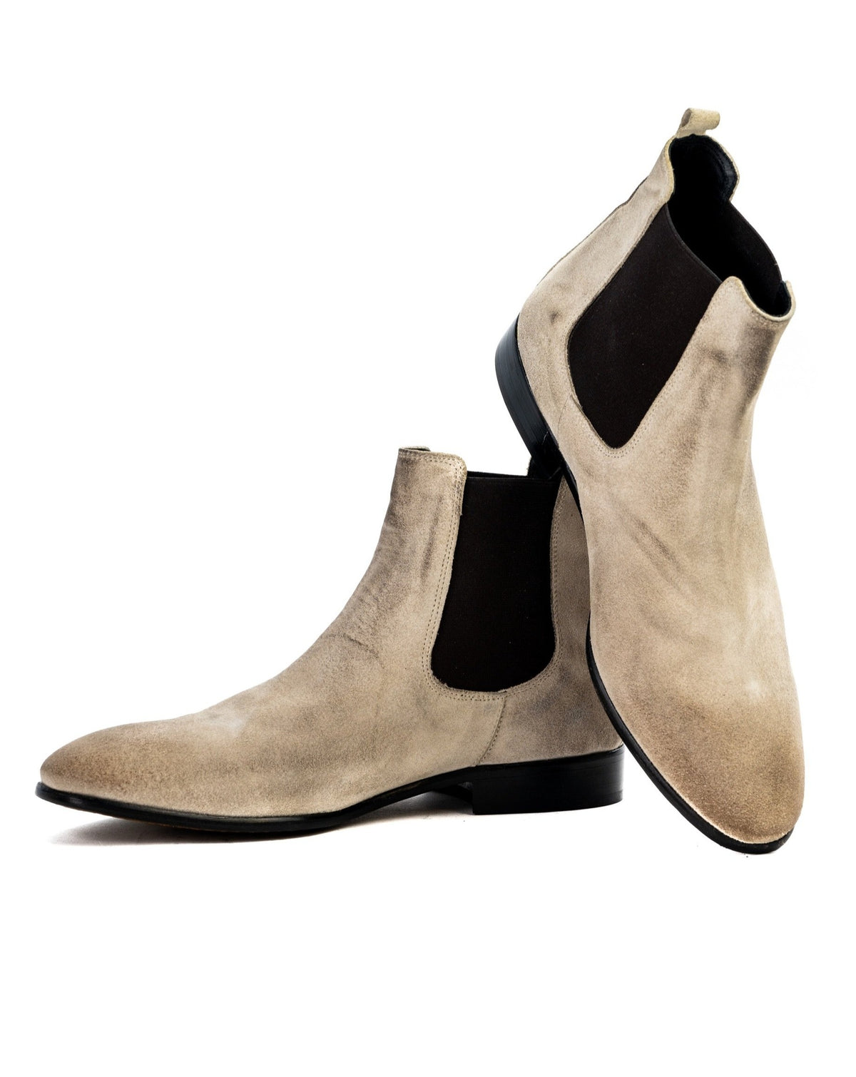Beige suede Chelsea boots with black elastic side panels and pointed toe, perfect for stylish casual wear.
