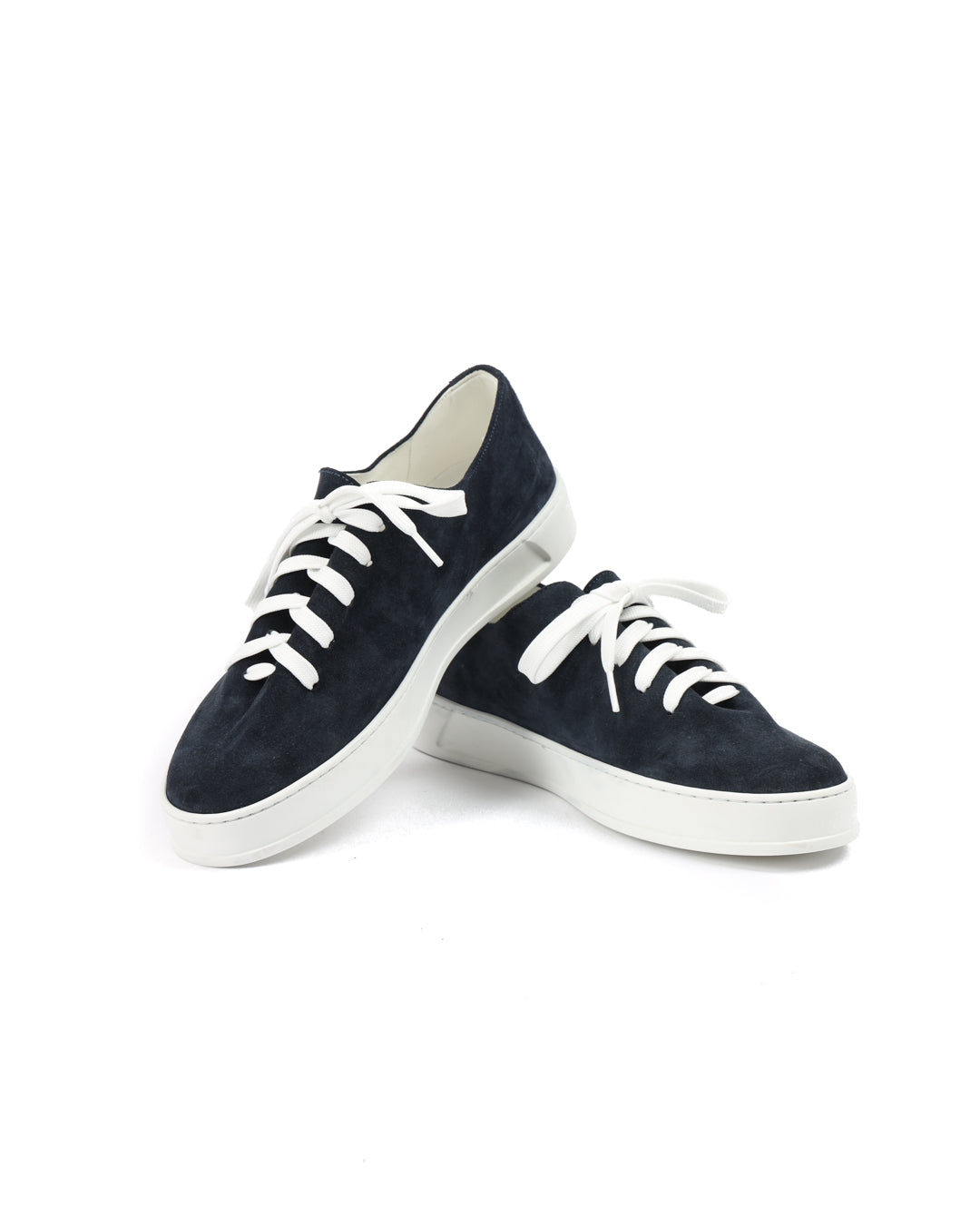 Navy suede sneakers with white laces and rubber soles, perfect for casual wear.
