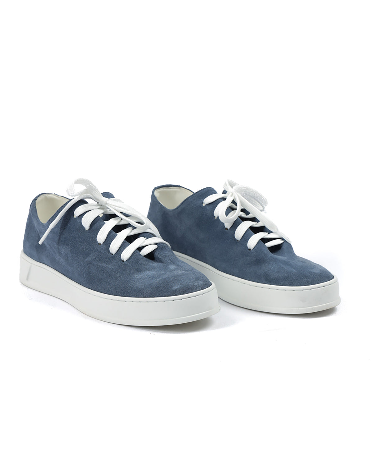 Blue suede sneakers with white laces and a rubber sole, perfect for casual outfits and everyday wear.