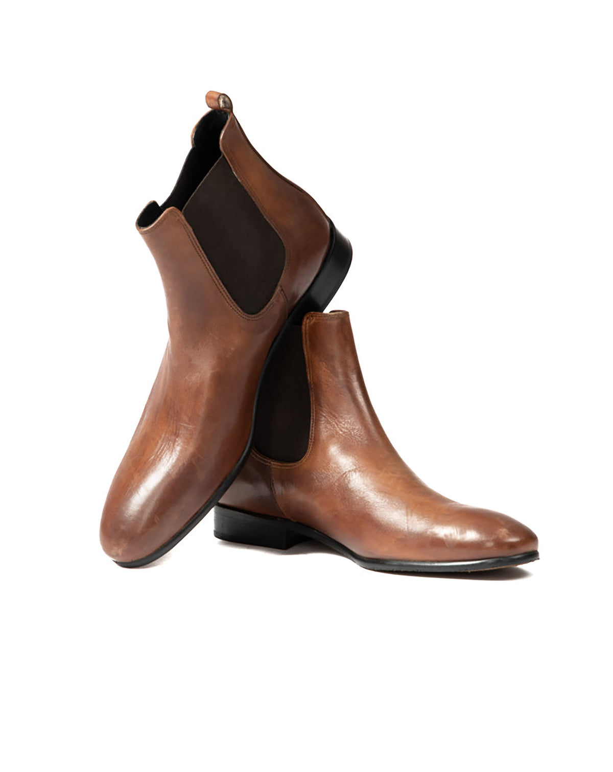 Brown leather ankle boots with elastic side panels and a sleek, modern design. Perfect for stylish casual wear.