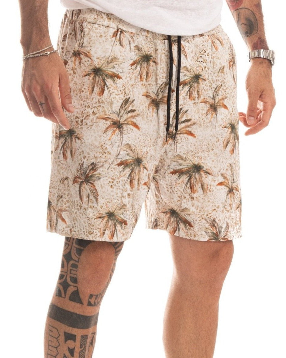 Beige palm print shorts with black drawstring waistband, front detail