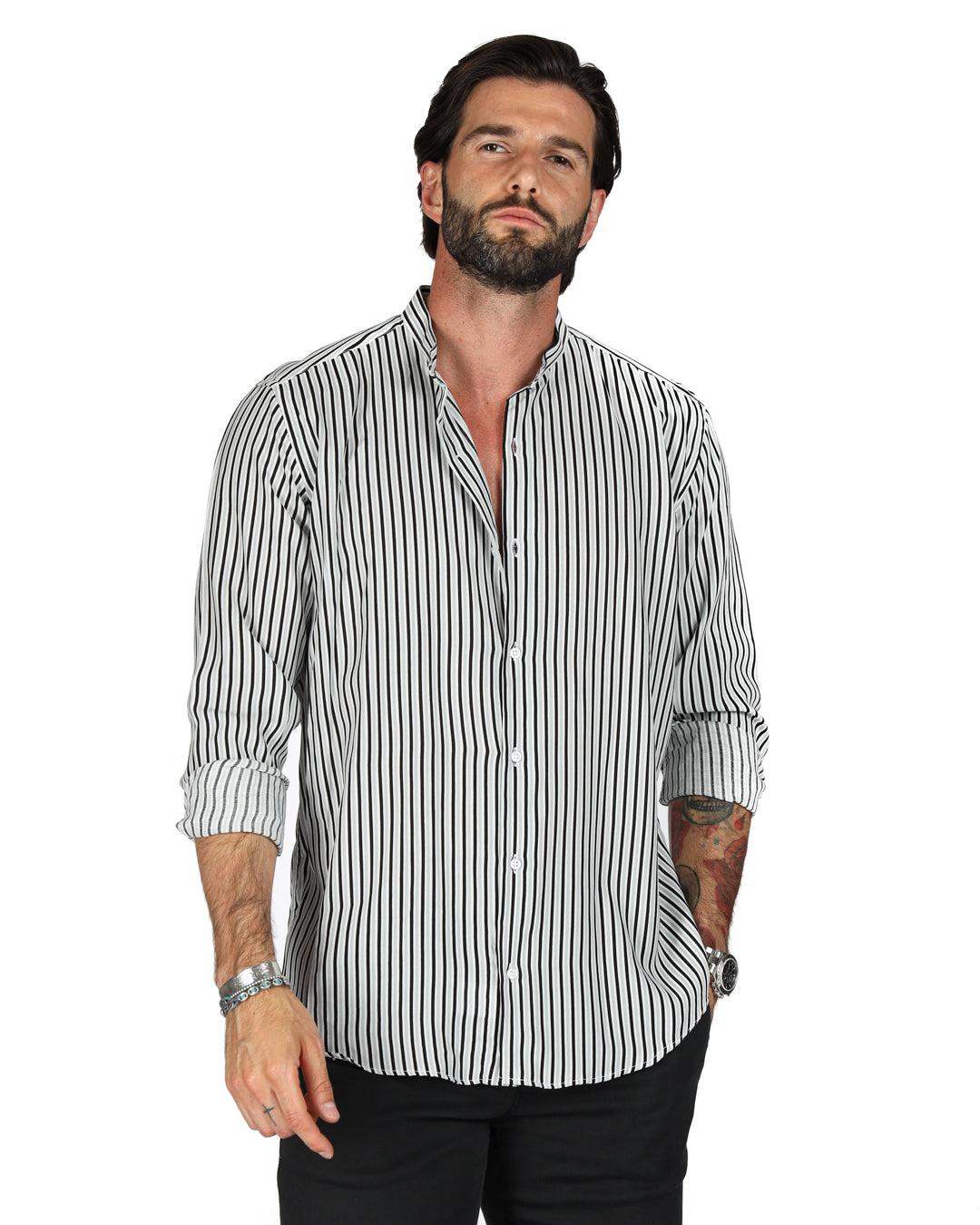 Men's black and white striped shirt with band collar and button front, sleeves rolled up, shown on a model