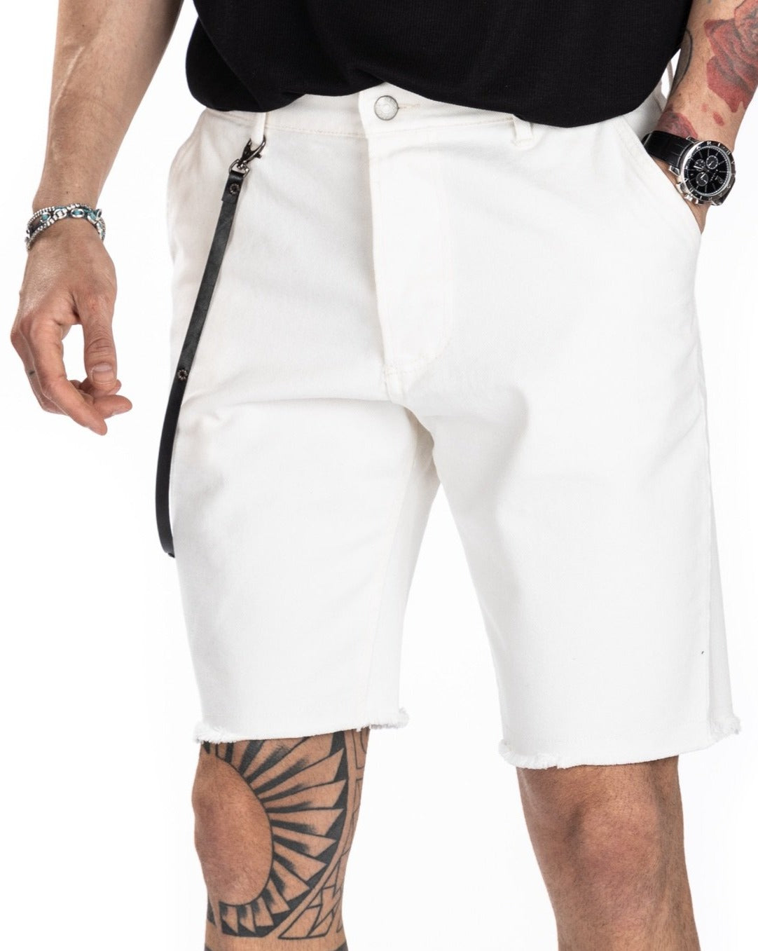Men's off-white denim Bermuda shorts with frayed hem and back pockets, shown from behind on a model