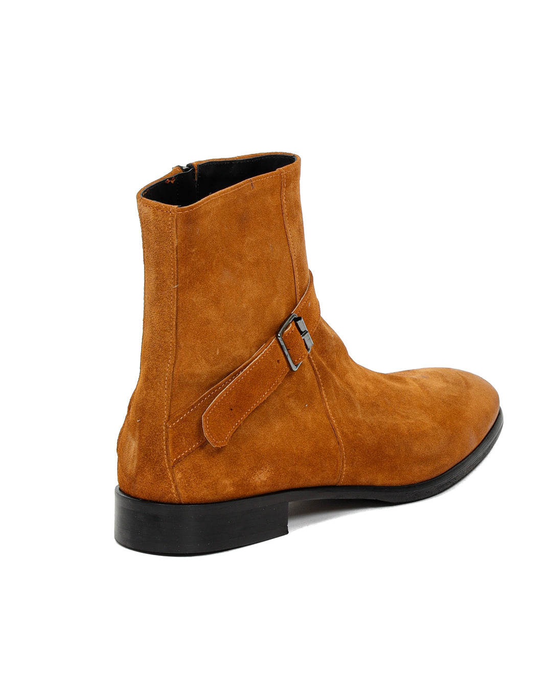 Tan suede ankle boot with buckled strap detail and black sole, shown from the back