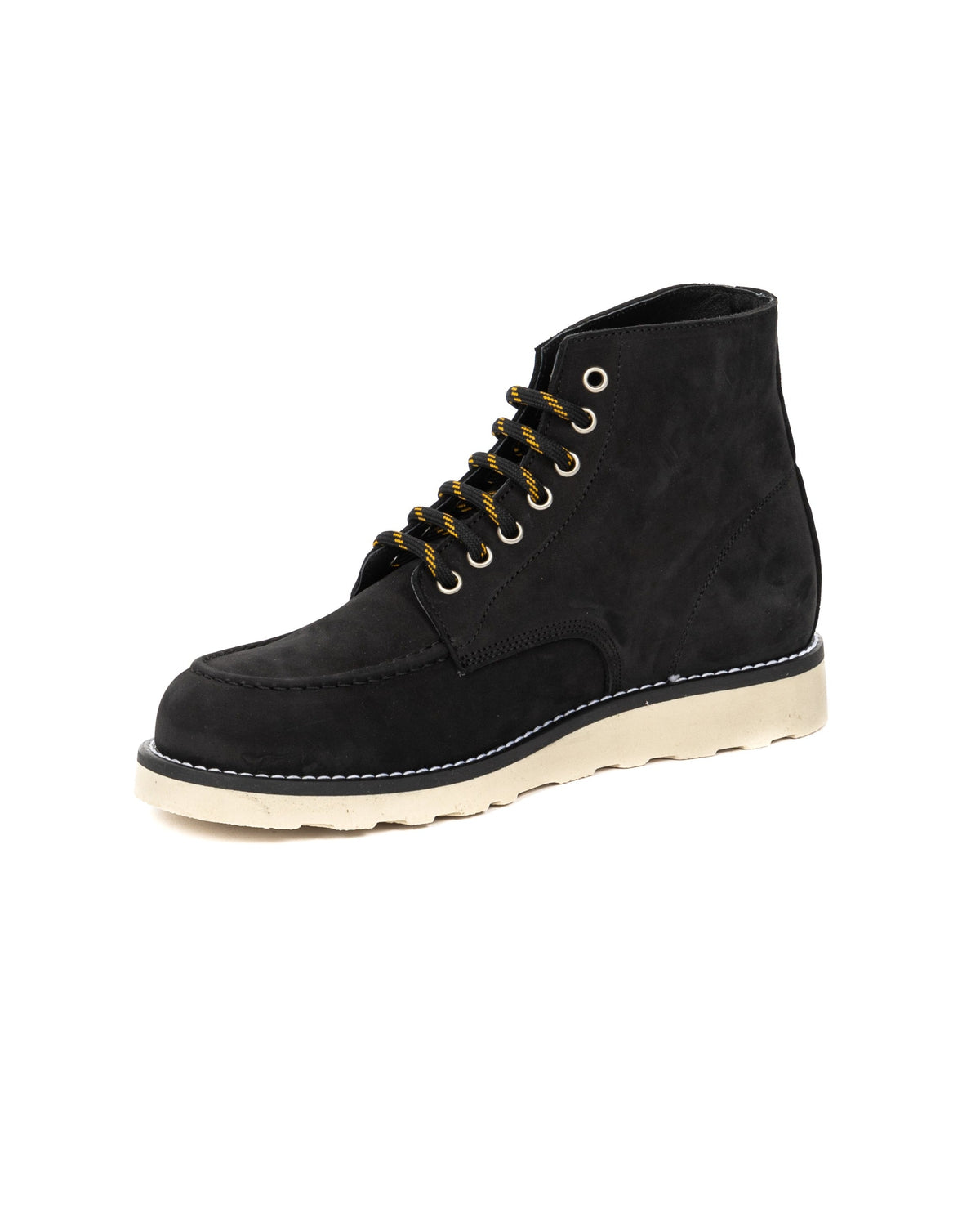 Black suede moc-toe work boot with cream rubber sole, yellow striped laces, and metal eyelets.