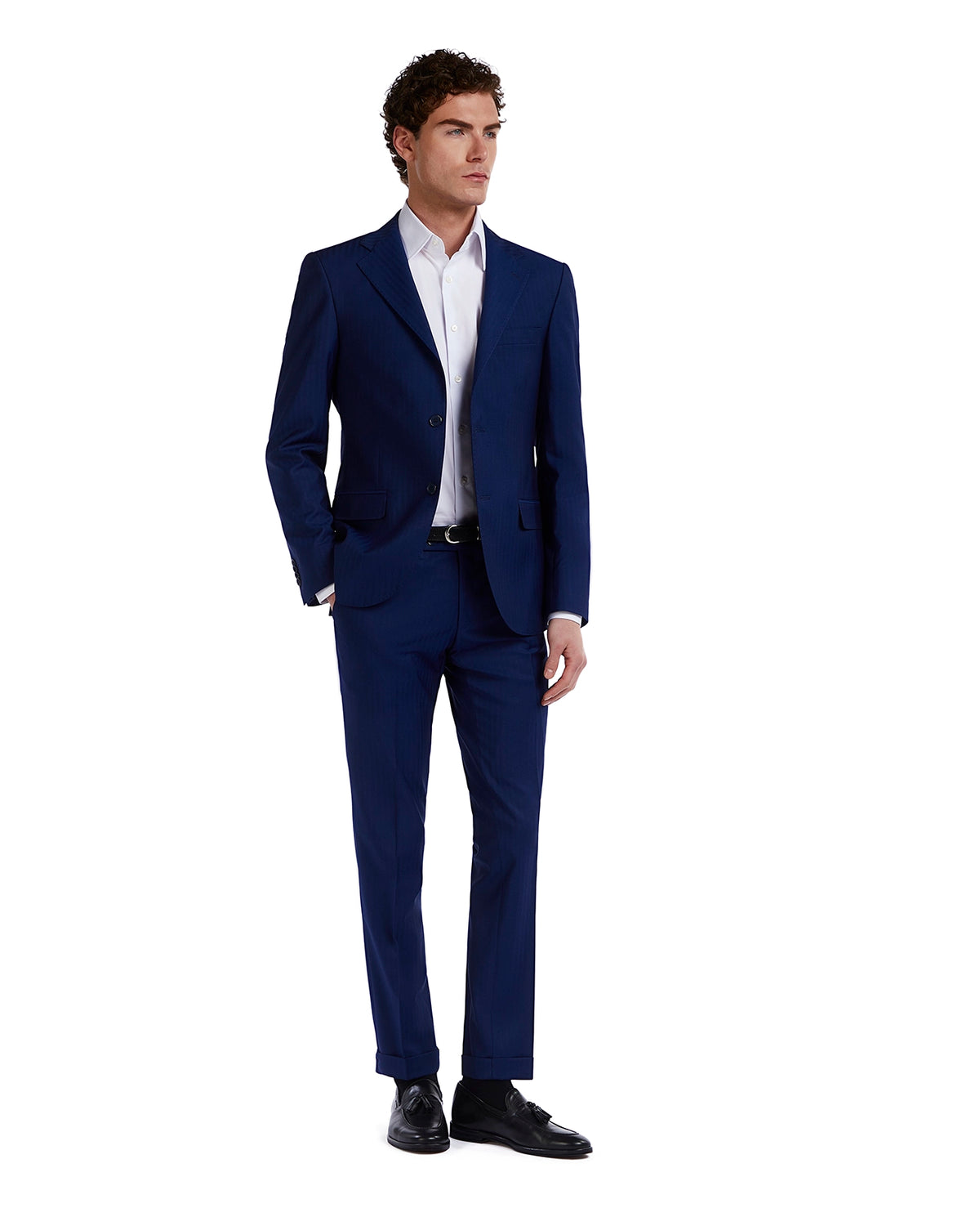 Men's slim-fit navy blue suit, crafted from lightweight fabric, paired with a classic white shirt for a polished look.
