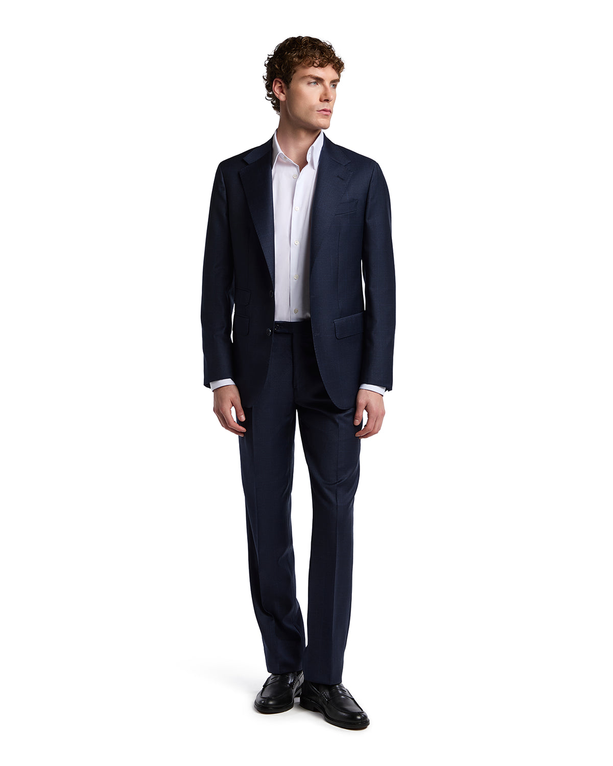 Navy blue tailored suit made from luxurious wool, paired with a crisp white shirt, perfect for formal occasions.