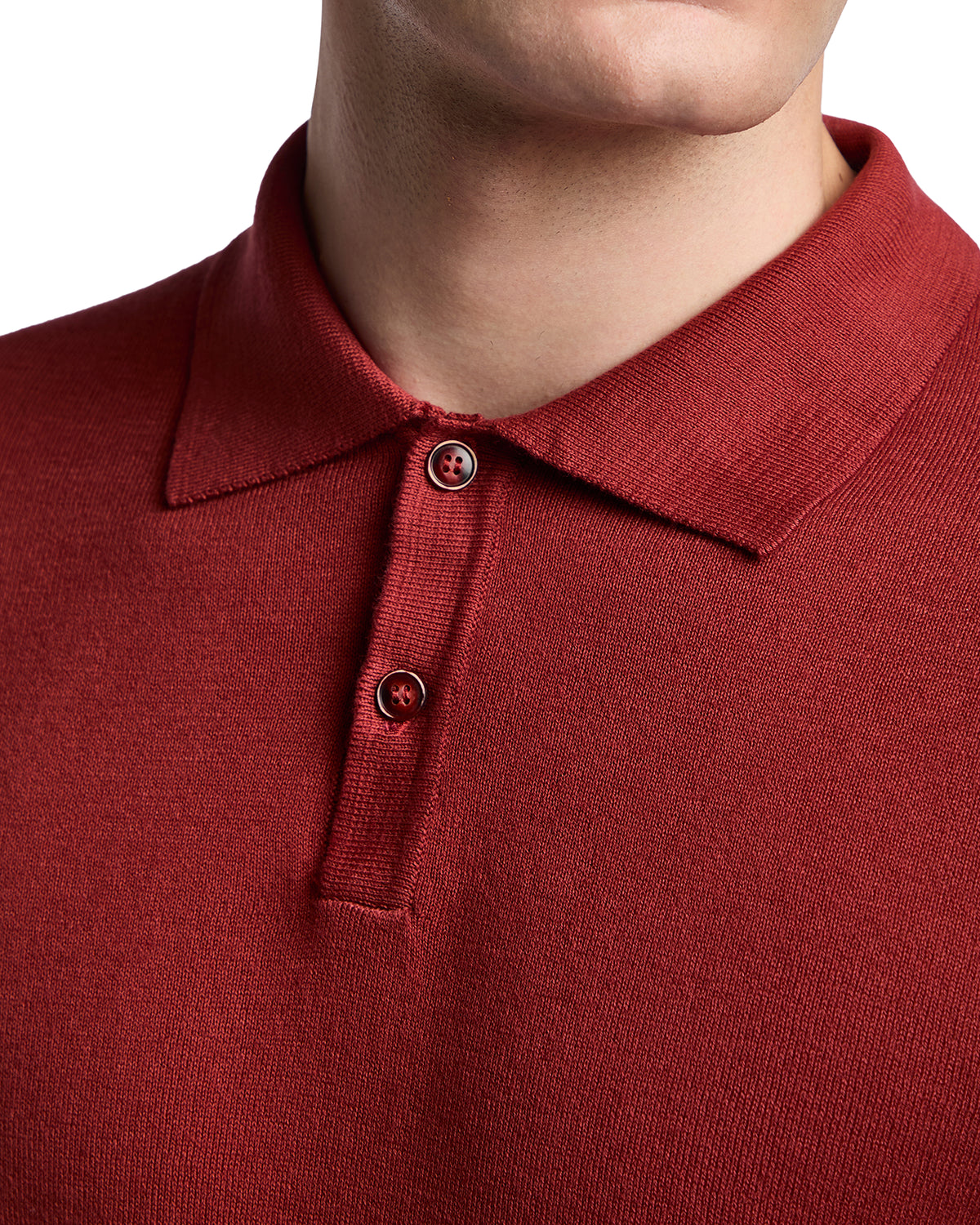 Men's red knit polo shirt with short sleeves and button placket, perfect for casual and semi-formal occasions.