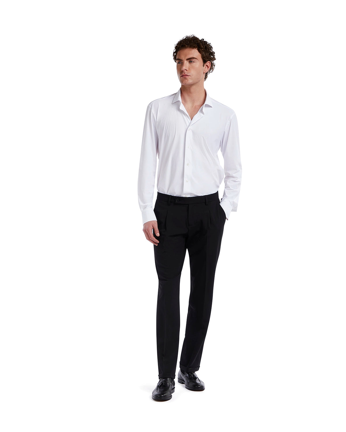 Men's slim fit white dress shirt in lightweight cotton, paired with black tailored trousers for a sleek, classic look.