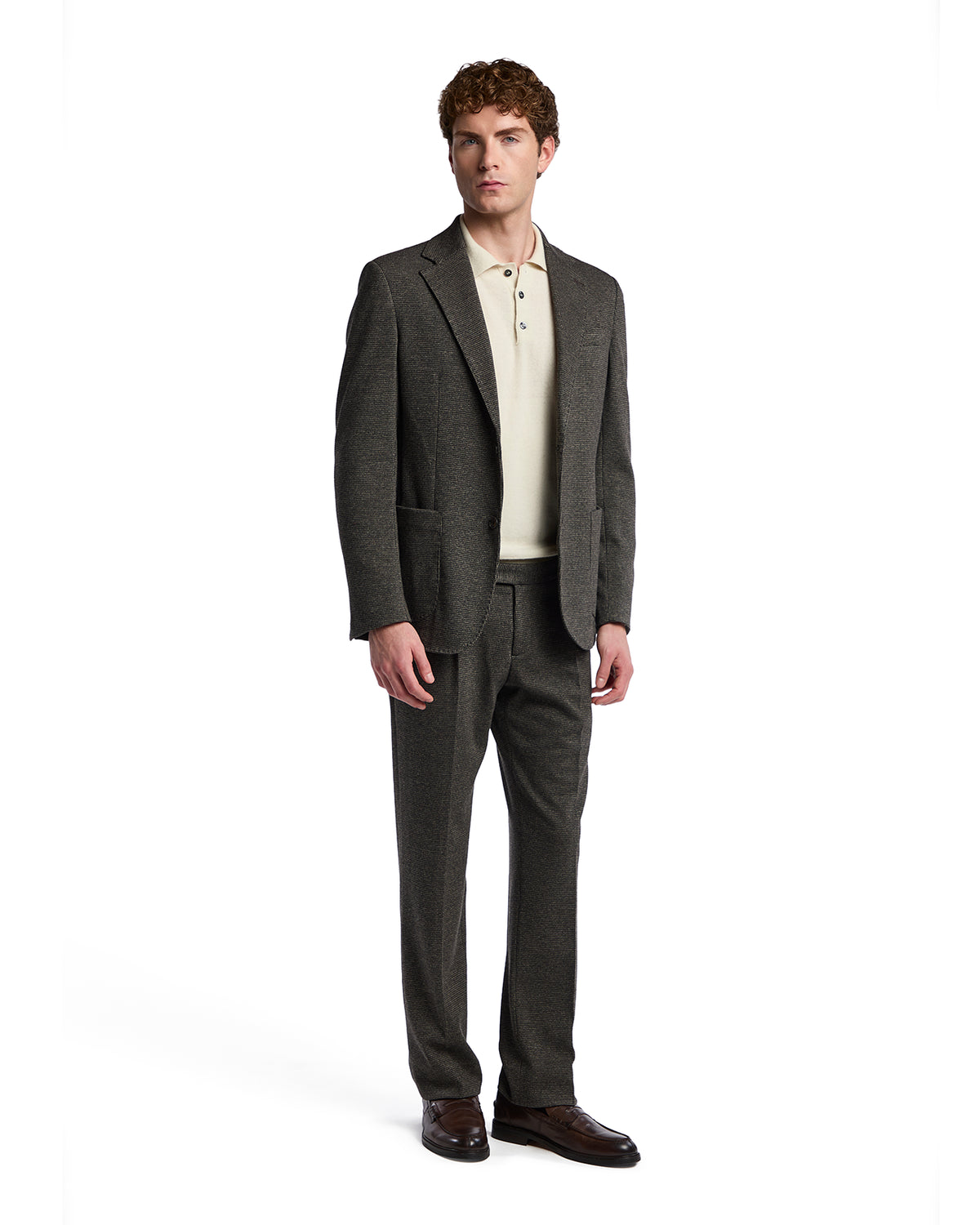 Men's charcoal gray tailored suit with a light beige polo, crafted from premium wool blend for a sophisticated look.