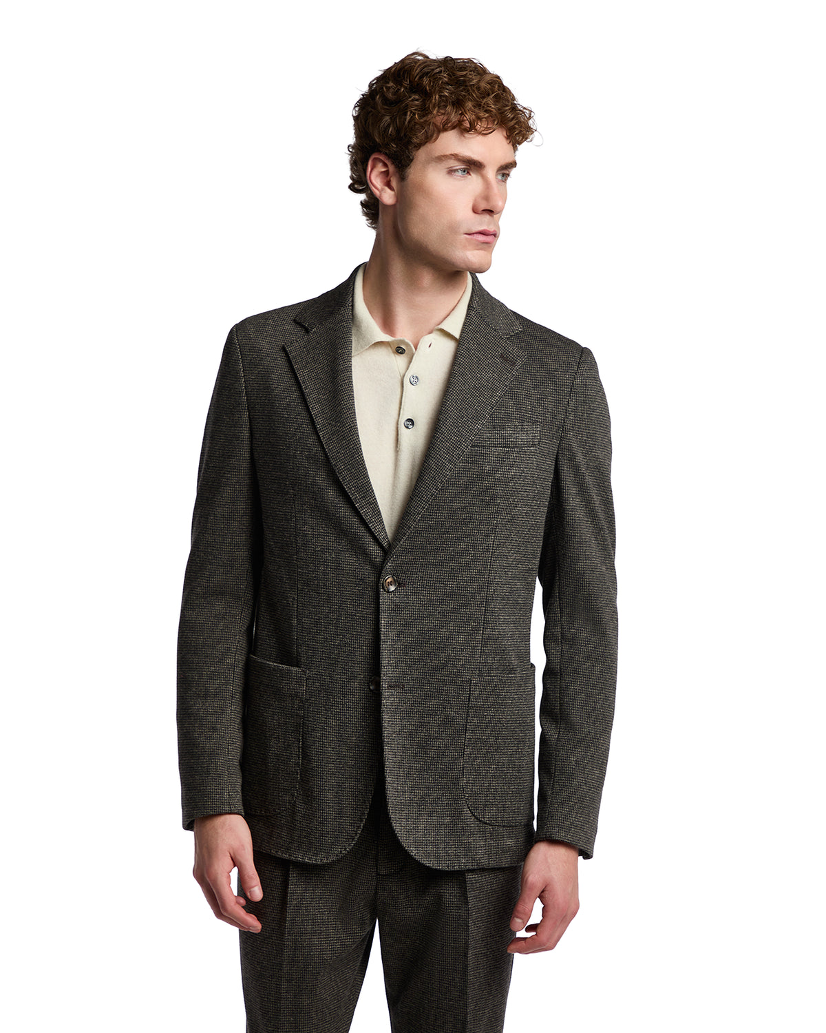 Men's dark gray wool blazer with notch lapels, paired with a light beige polo for a smart-casual look.