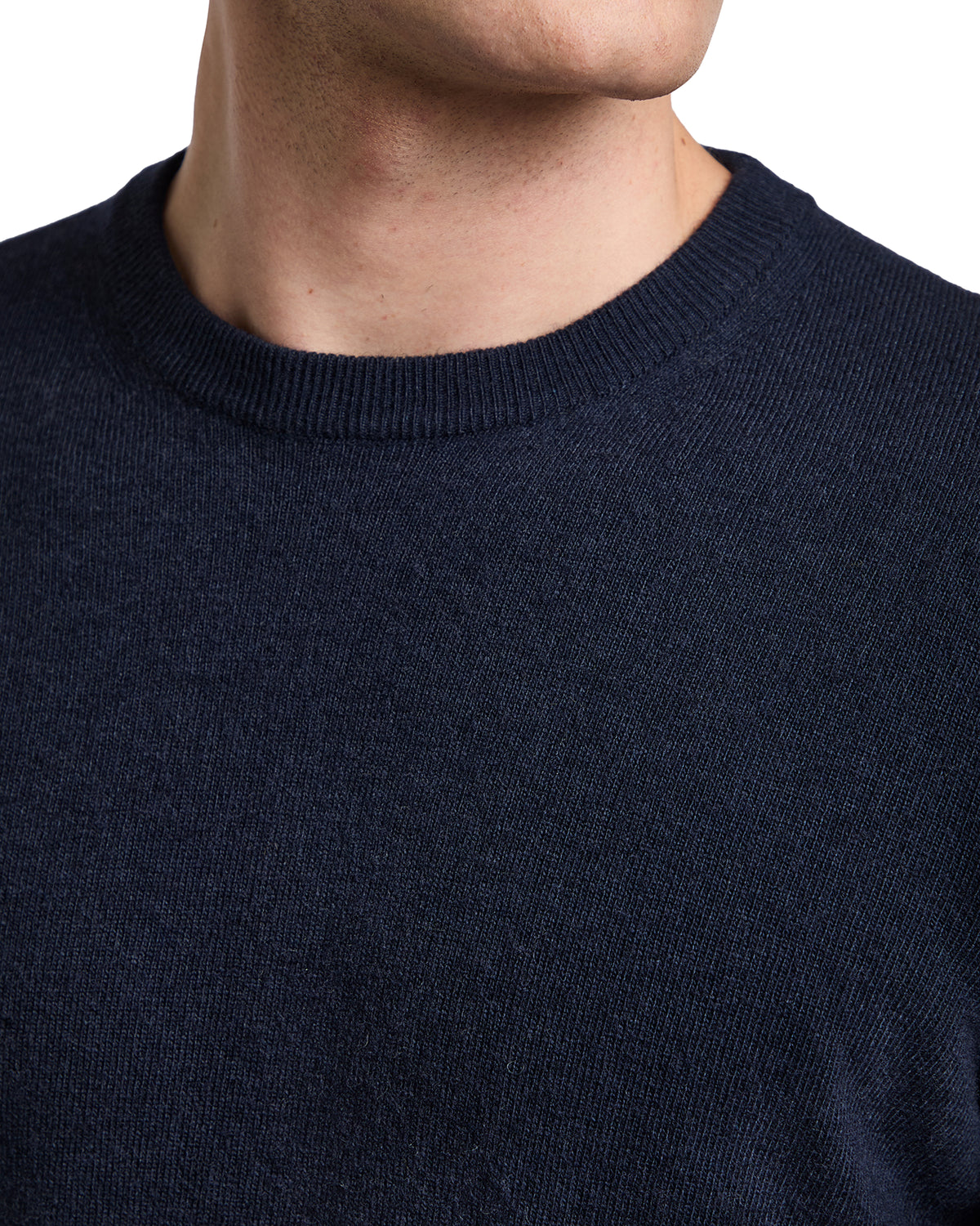 Navy blue cashmere crewneck sweater for men, soft texture, versatile style suitable for casual or semi-formal wear.