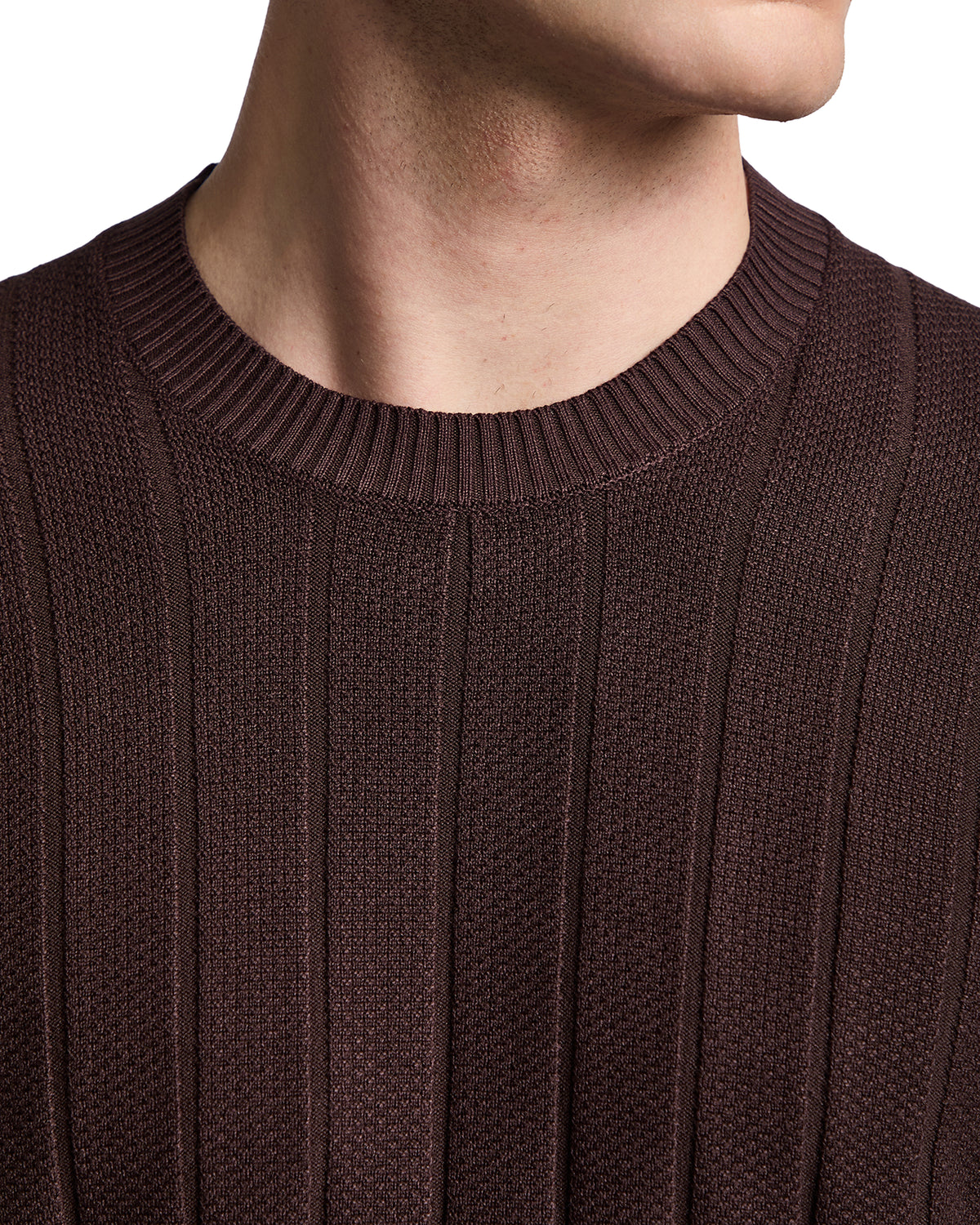 Brown ribbed knit sweater with a classic crew neckline for a stylish, modern look. Perfect for layering in cooler weather.