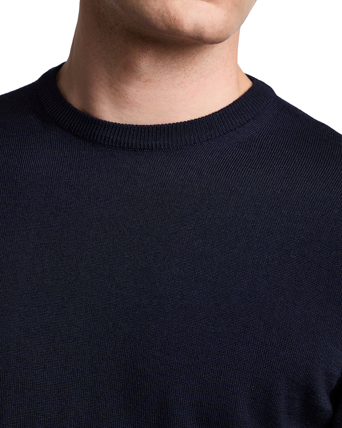 Navy blue men's crew neck sweater made from soft, breathable cotton for a classic, casual look.