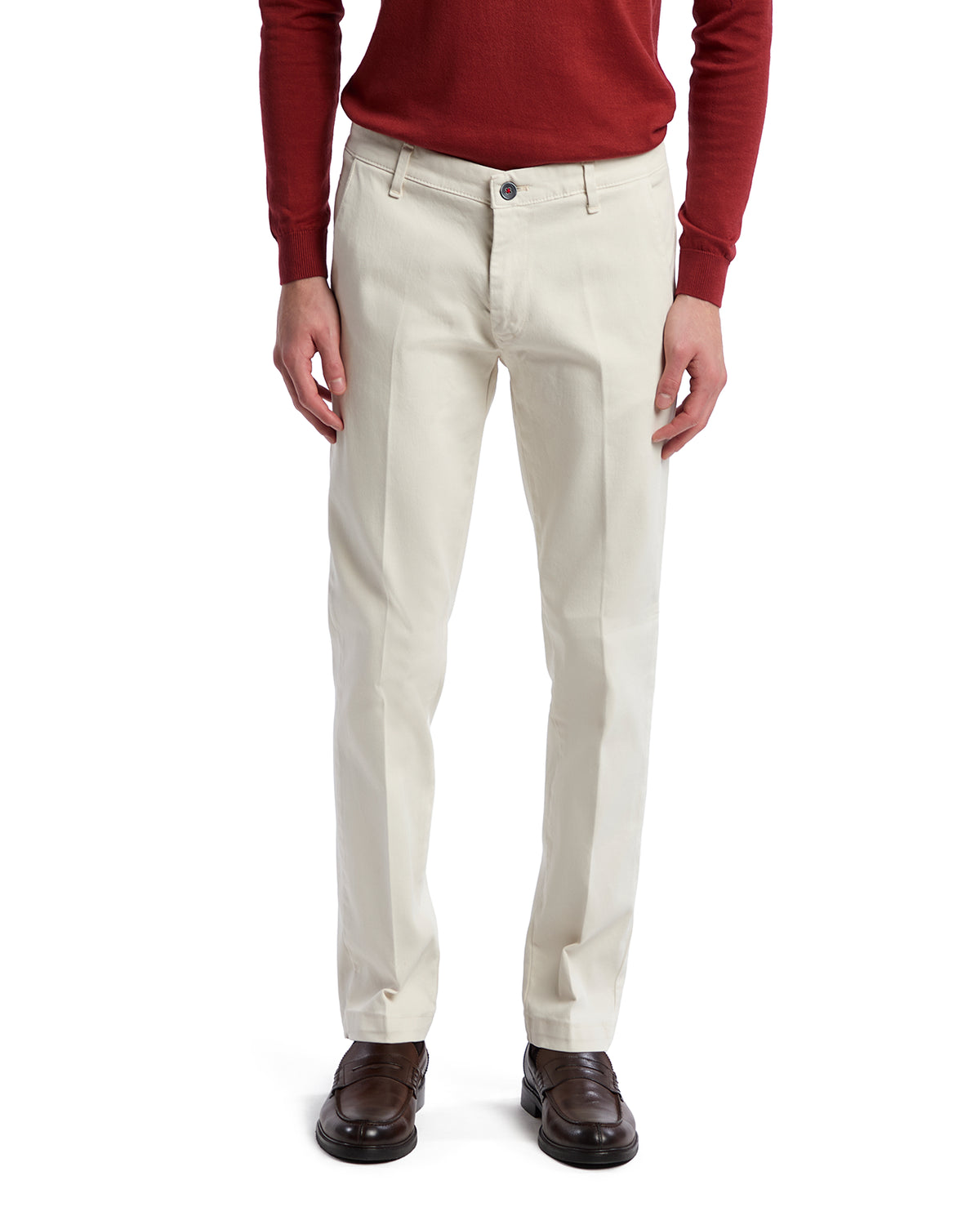 Men's cream cotton chinos with a straight fit, featuring a button closure and side pockets, styled casually.