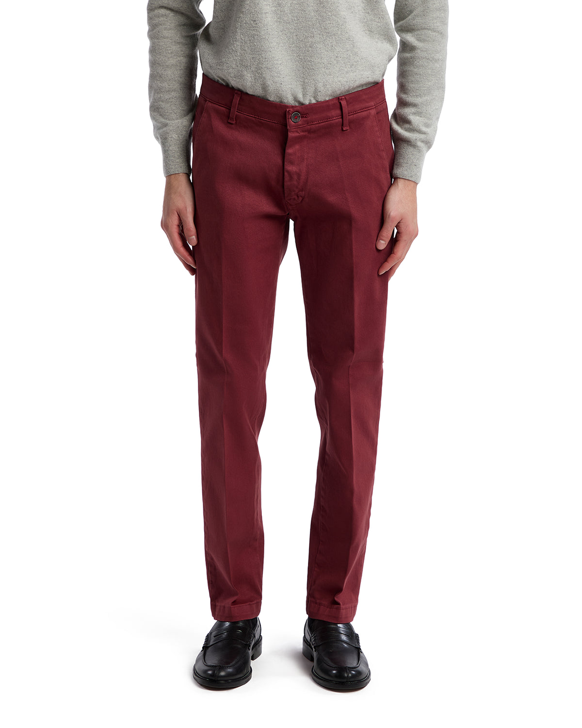 Men's burgundy cotton blend chinos, slim fit, styled with a light gray sweater and black shoes.
