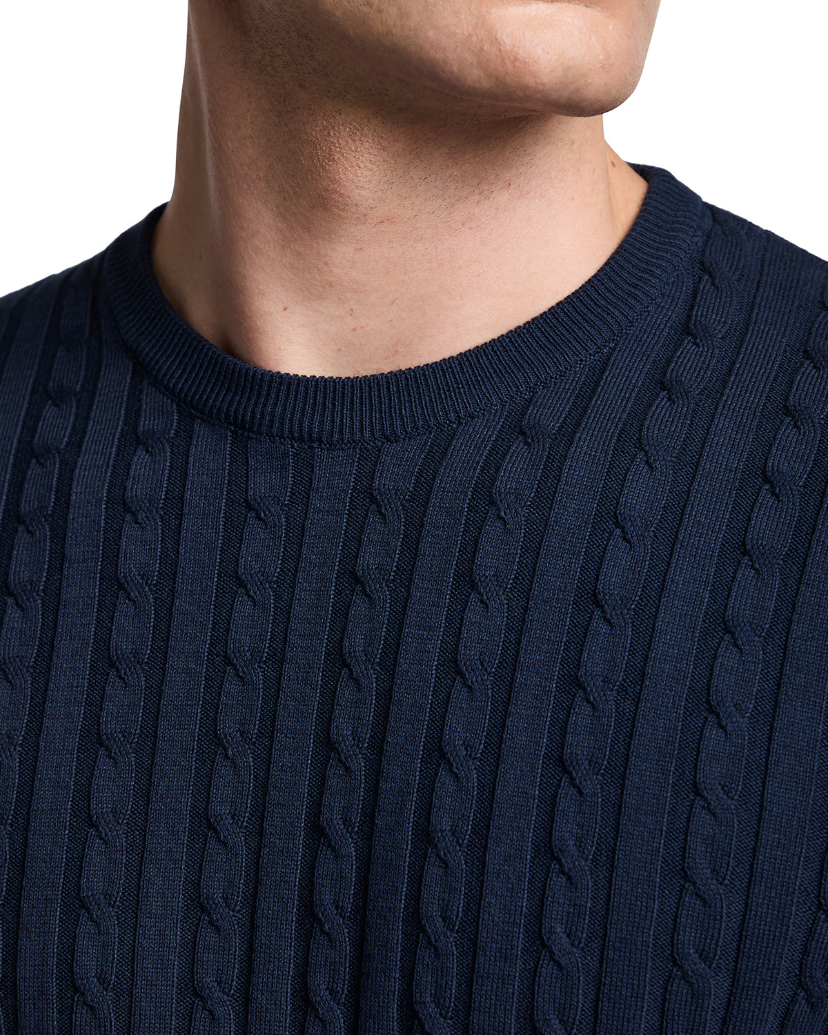 Navy blue cable knit men's sweater with a classic crew neckline and textured detail. Ideal for casual layering.