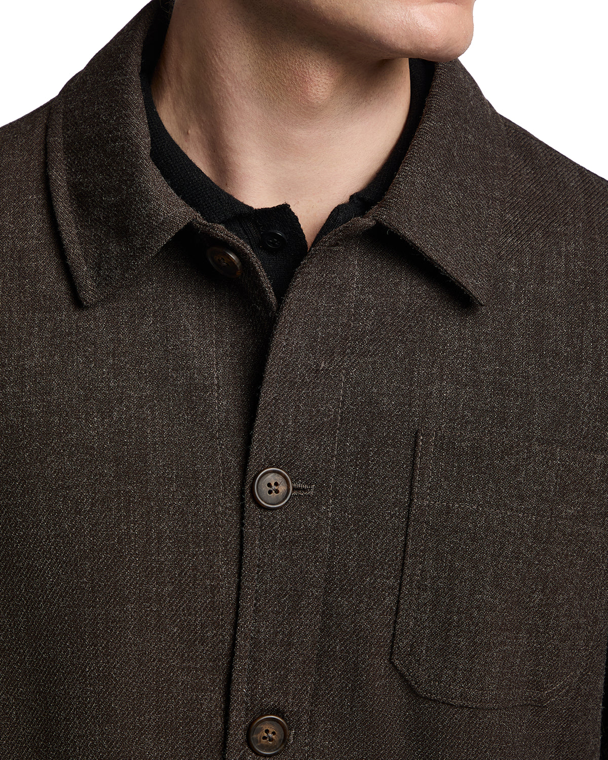 Brown wool blend shirt jacket with a collared neck and button front, featuring a chest pocket and a textured finish.